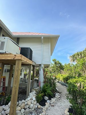 White K-Style Gutters Installed with White Downspouts in Sanibel FL