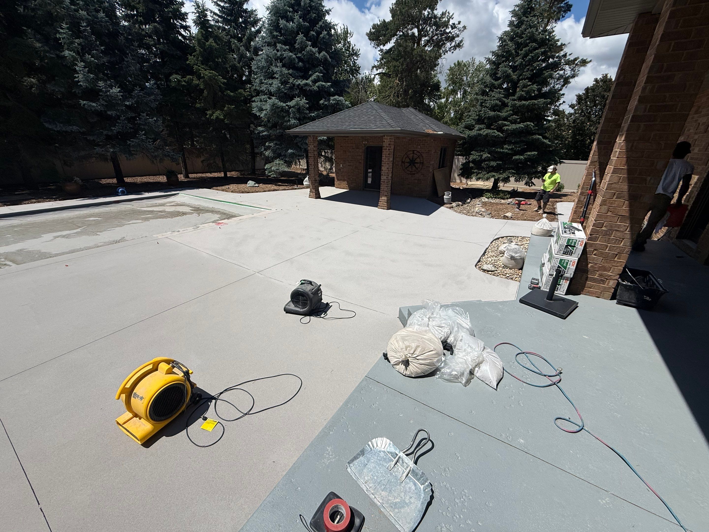 Decorative Concrete Pool Deck and Patio Resurfacing in Sioux Falls by Select Painting, Coatings & Garage Cabinets