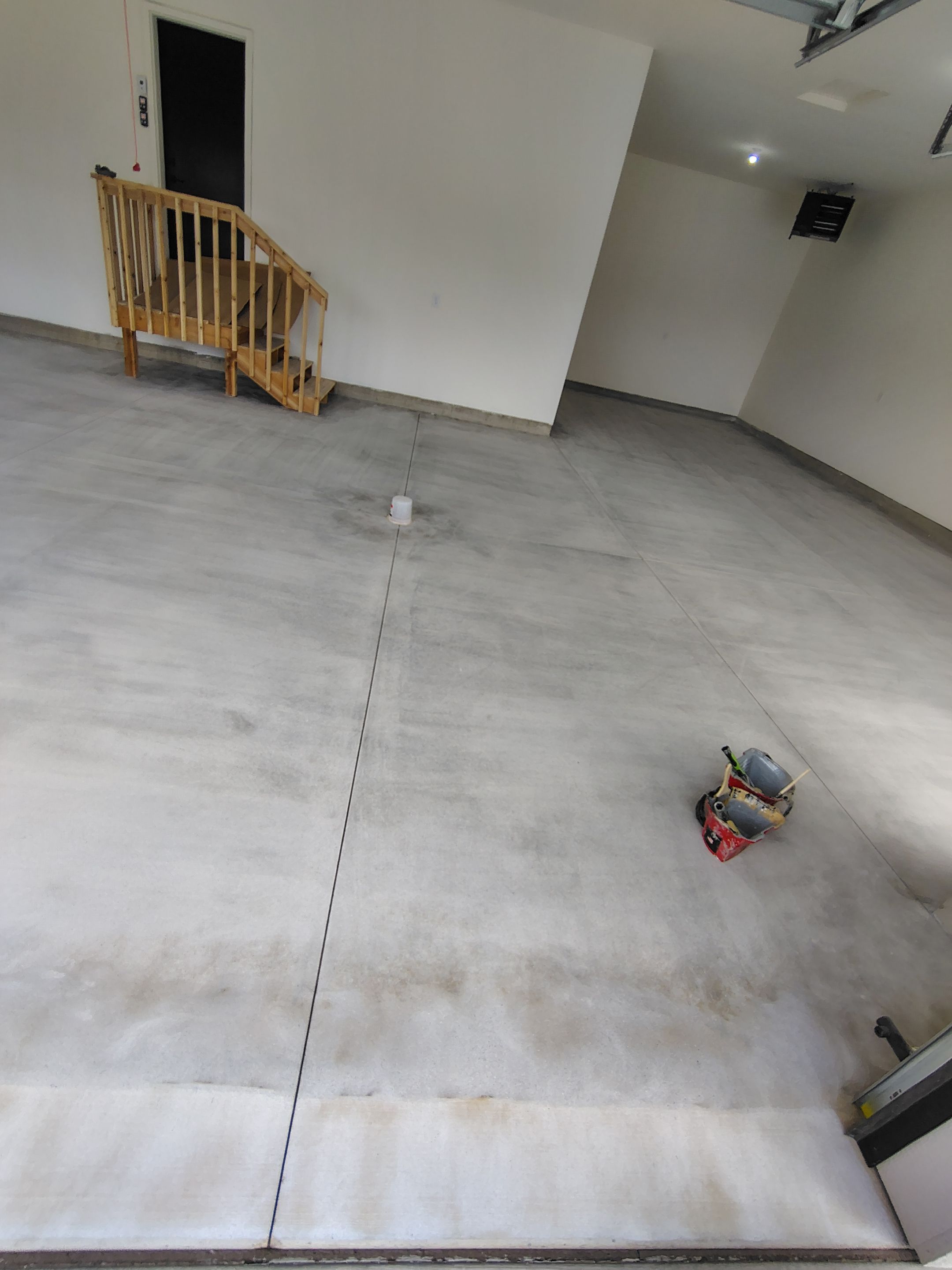 Sioux Falls Garage Floor Transformation with Gray Decorative Flake Coating by Select Painting, Coatings & Garage Cabinets