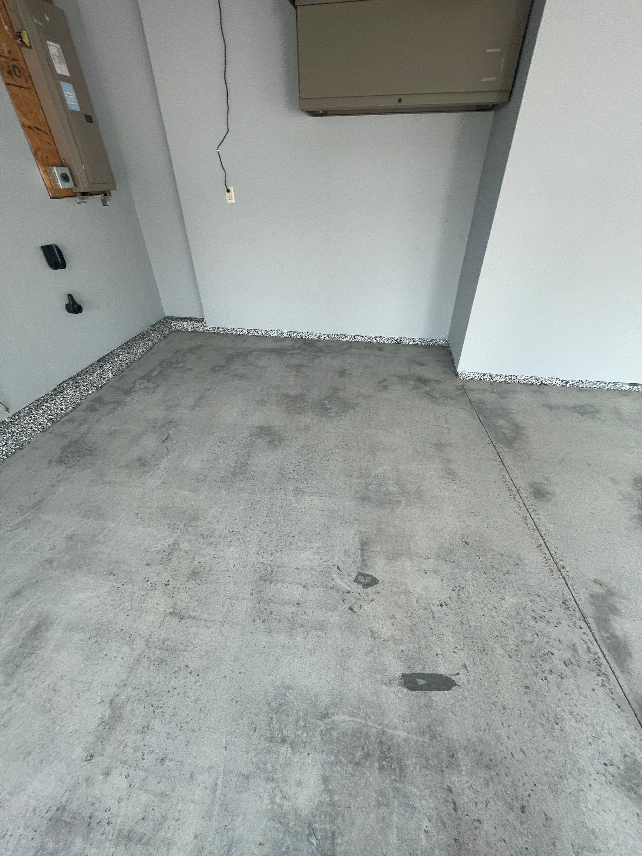 Sioux Falls Garage Concrete Coating Installation with Domino Flake by Select Painting, Coatings & Garage Cabinets