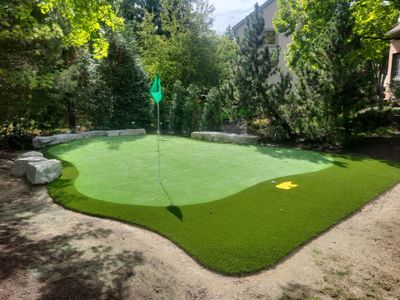 Custom Backyard Putting Green around Landscape Boulders in Hilliard