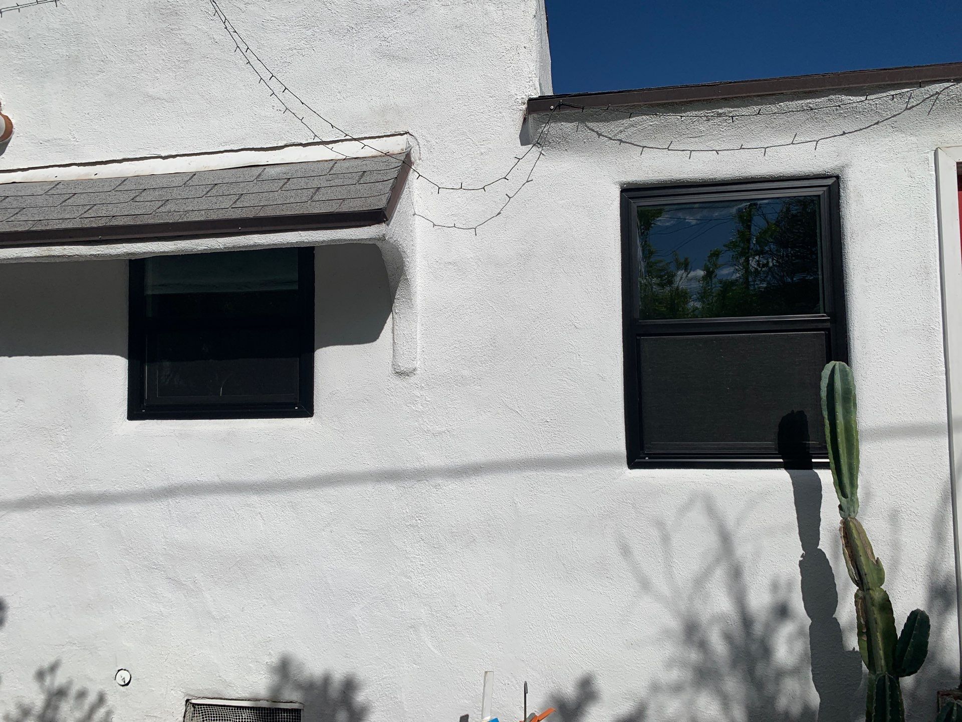 Window Installation using Black Anlin windows by American Window Company