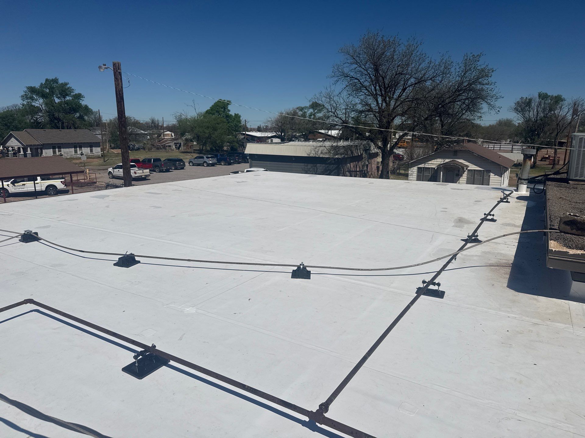 Hollis High School Comprehensive TPO Roof Replacement and Restoration by Secondary Rhodes