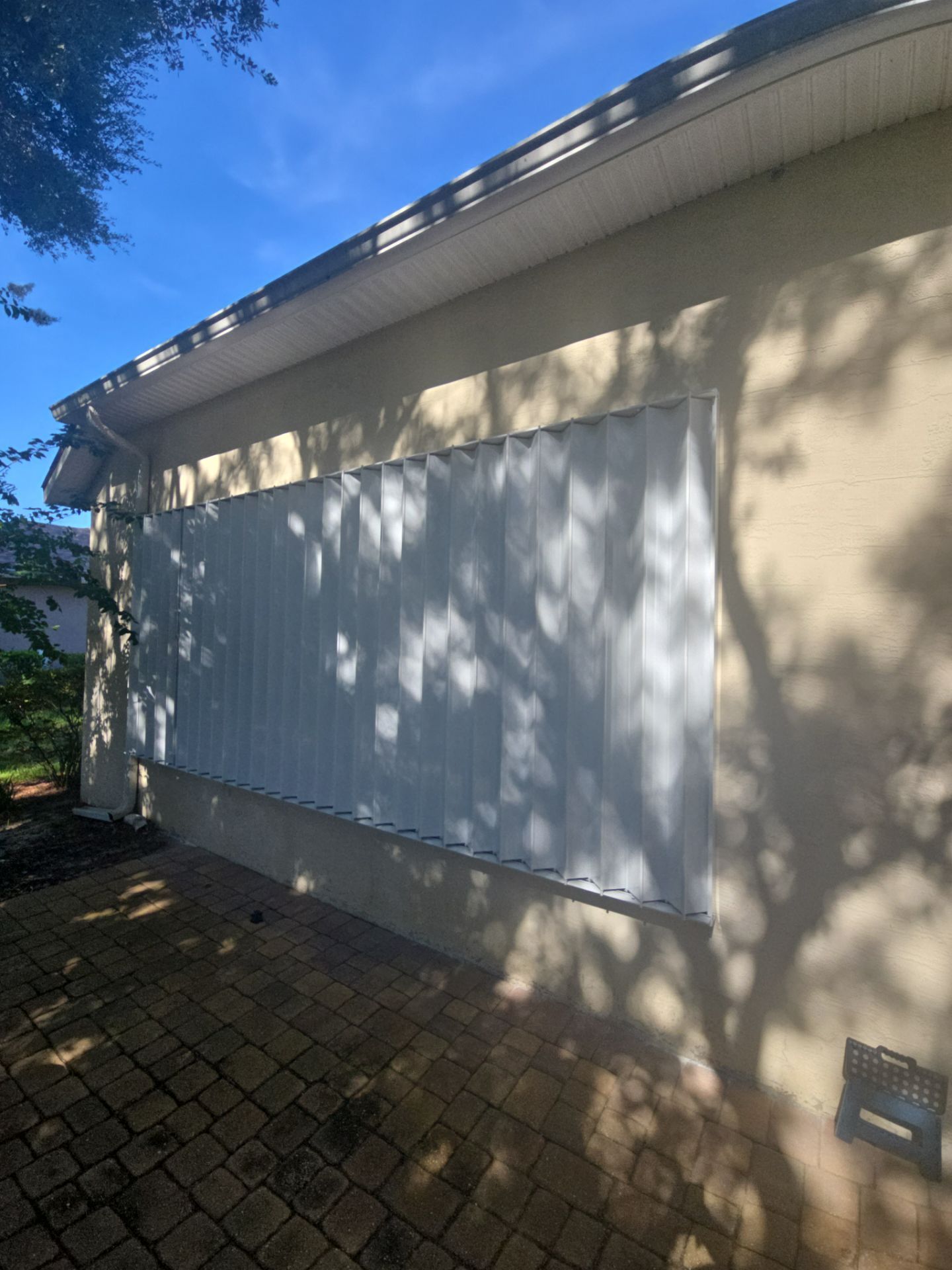 White Accordion Shutter by Smart Guard Shutters