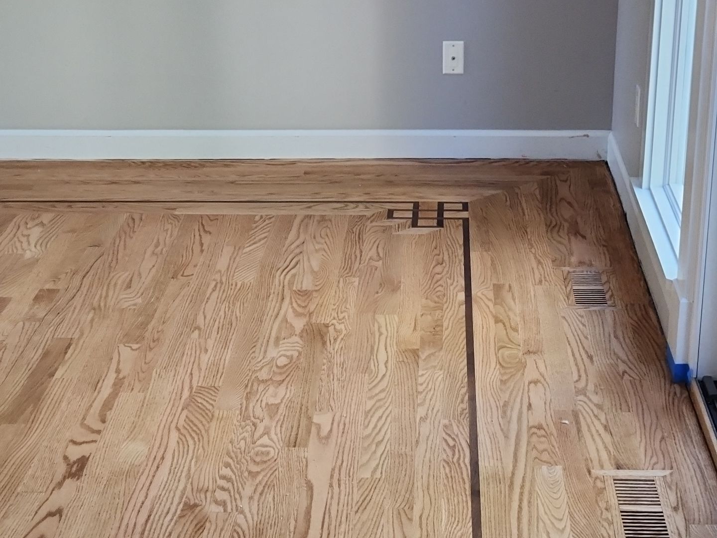 Ann Arbor Elegance: Red Oak and Walnut Living Room Masterpiece by Ann Arbor Hardwoods