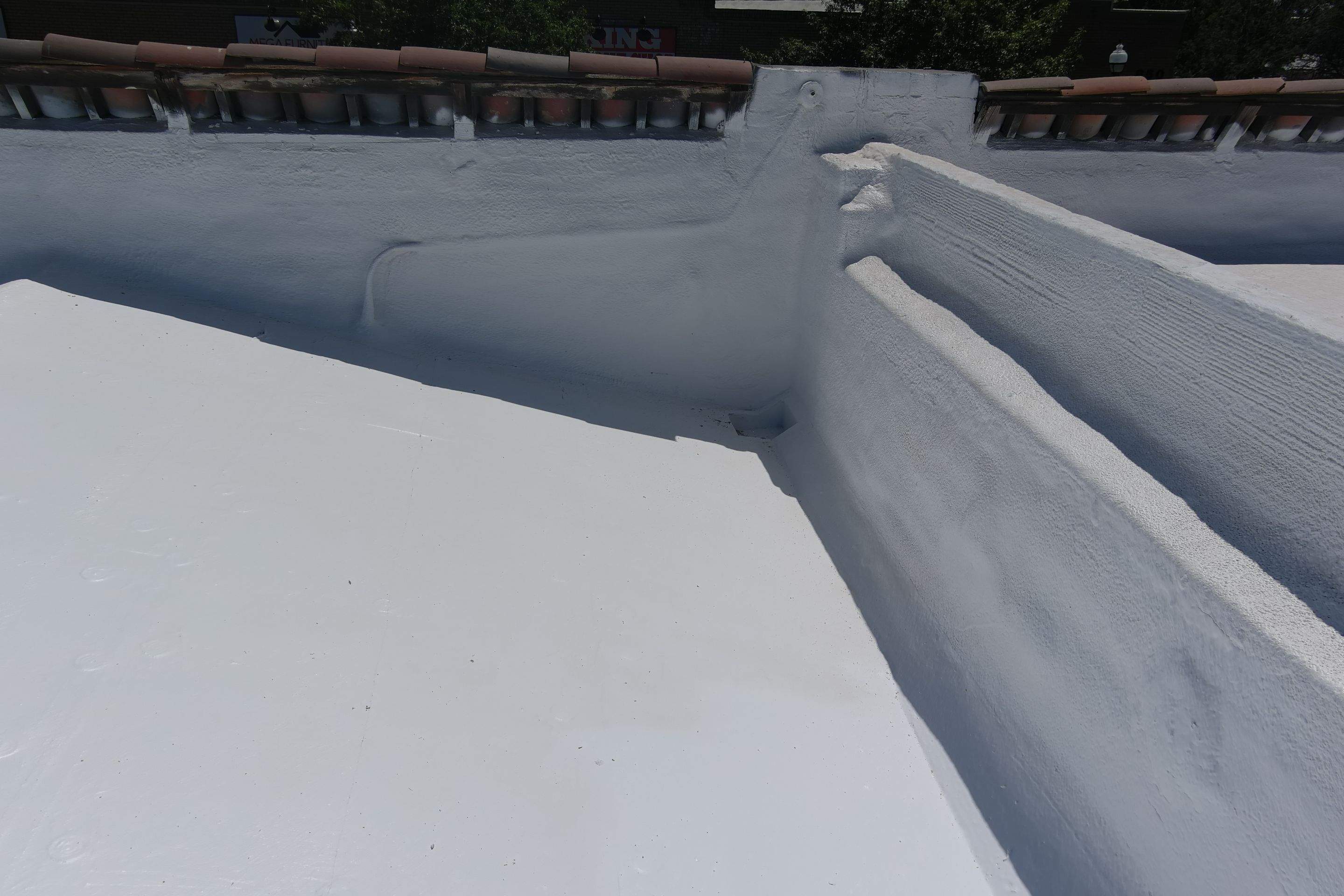 Commercial Roofing Installation using Conklin BenchPly system with PUMA top coat (imbedded fabric system) by Straight Edge Roofing Inc