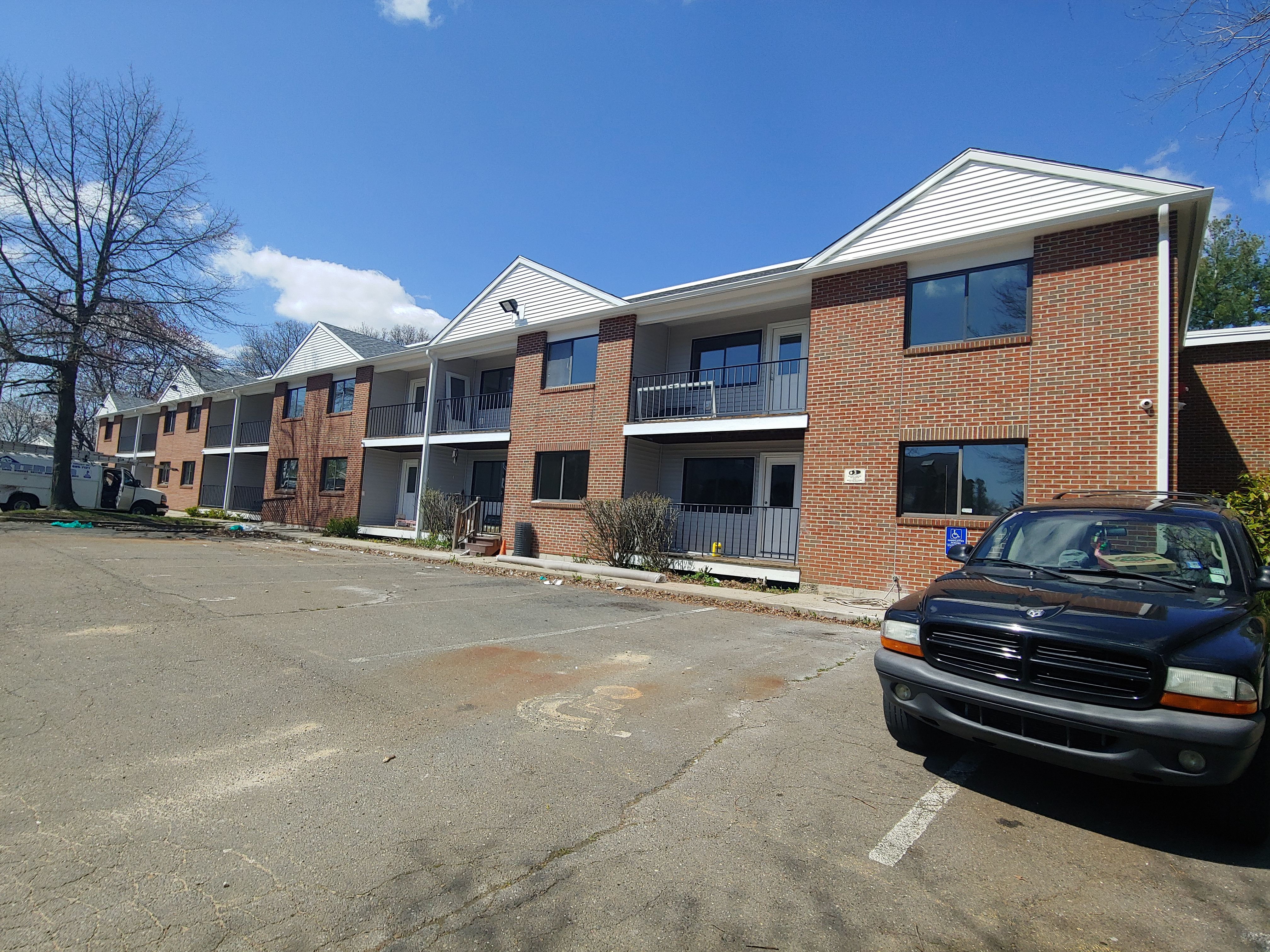 Commercial Roofing Installation using EPDM with white gutters by A Plus Exterior