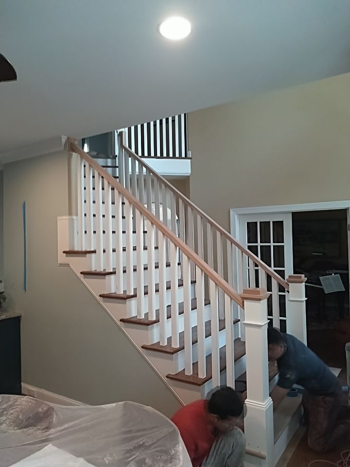 Stairway Installation using Red oak modern railings by House Custom Carpentry, LLC