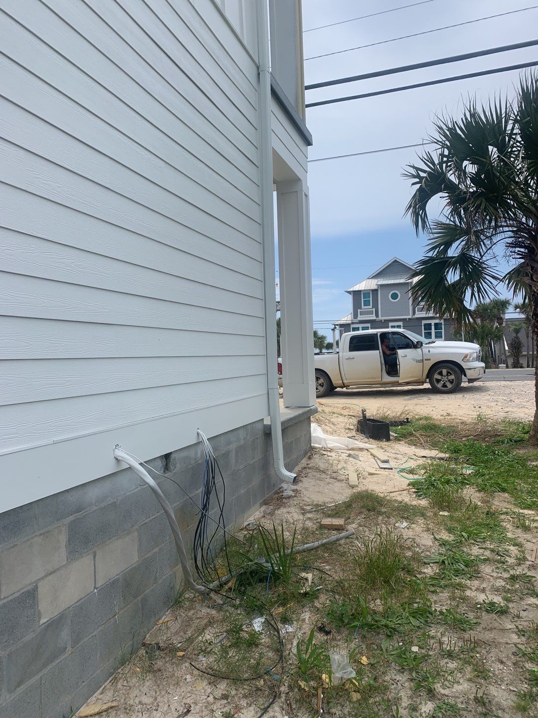 Downspout Installation for Multi-Story Building in Panama City FL by Gutter Professors