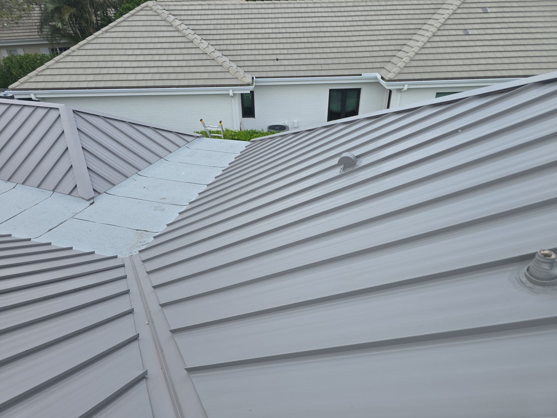 Kynar (Color Coated) 1.5" Standing Seam Metal Roof Installation by Sailfish Roofing