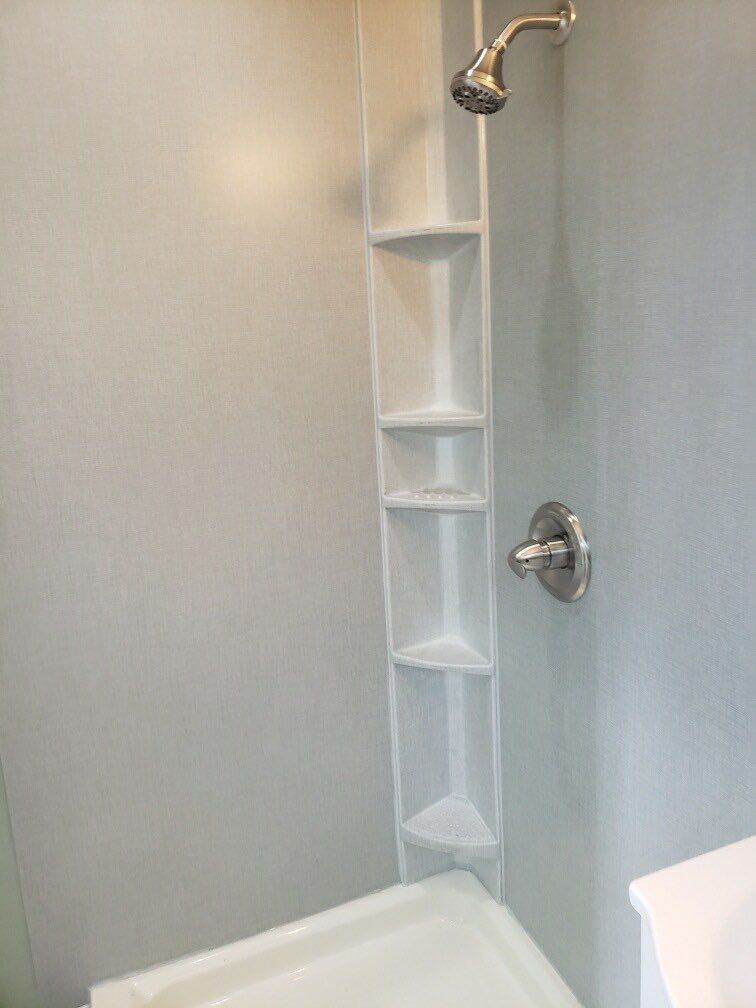 Bathroom Remodel using BCI Acrylic Shower System by Secure Construction Company Inc