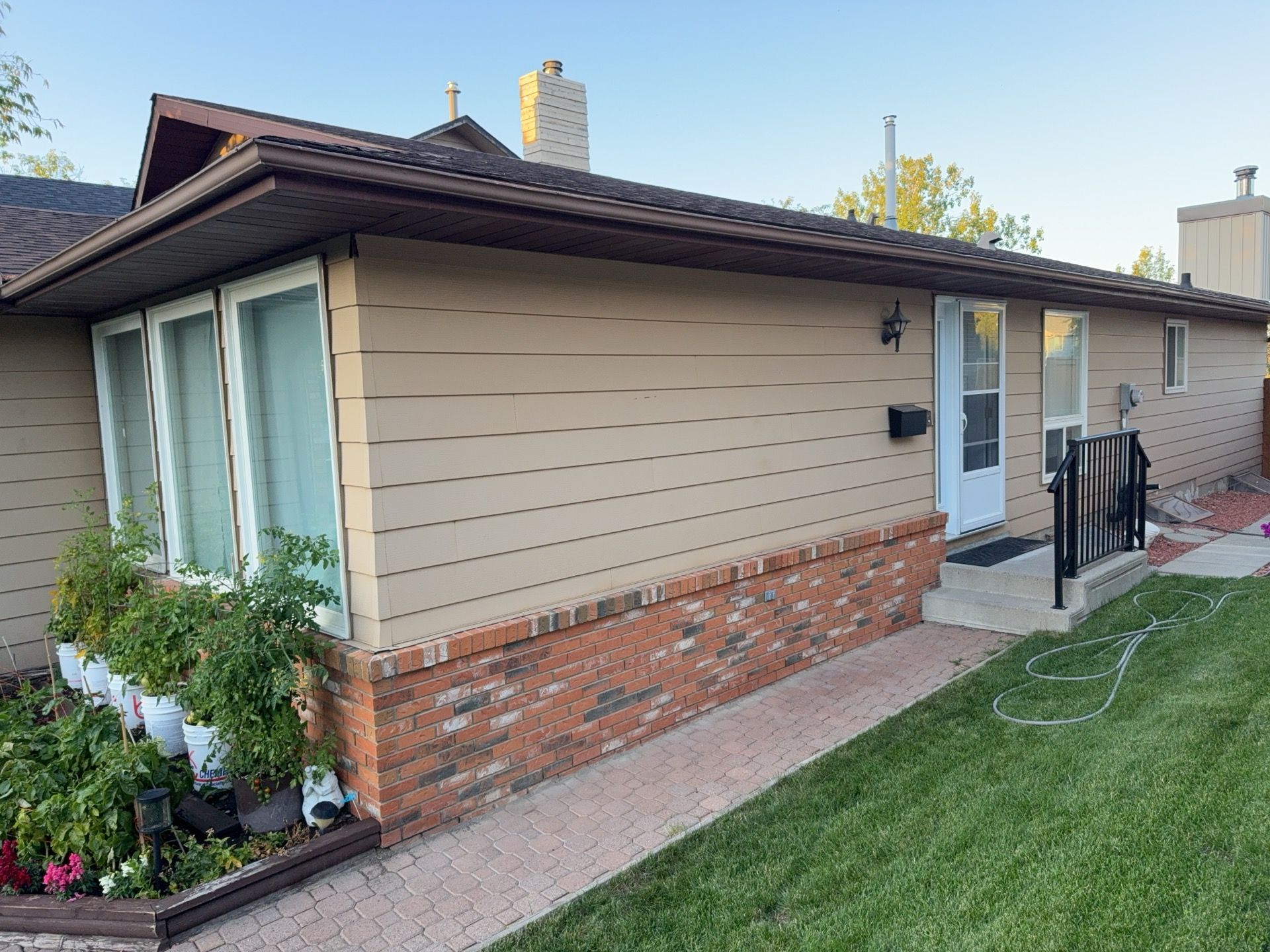 Calgary Chimney Chase Reconstruction and Exterior Siding Replacement by Smart Home Building Systems Ltd.