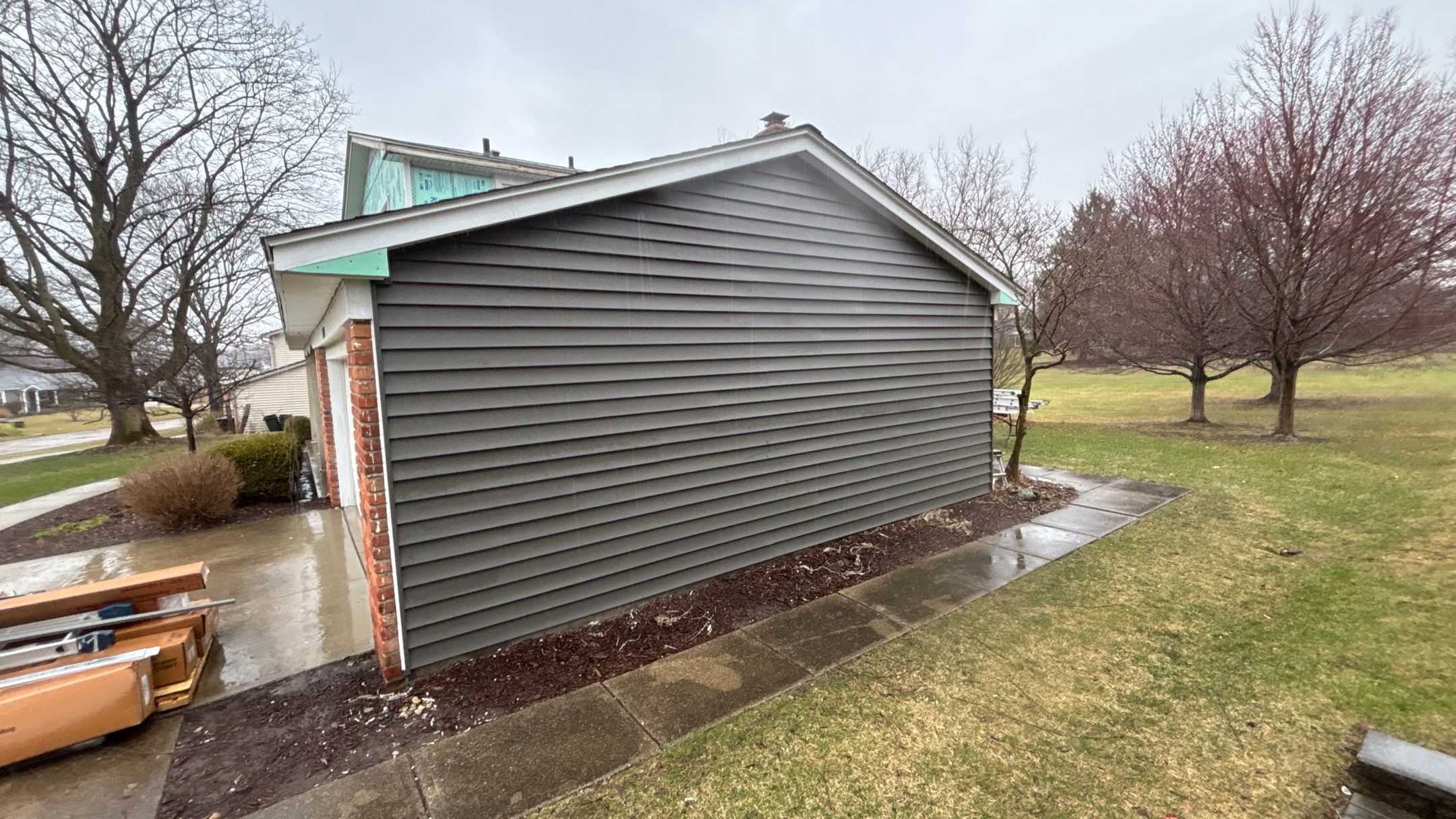Siding Replacement using Alside Charcoal Smoke and Roof Replacement using Owens Corning Peppercorn by 180 Contractors