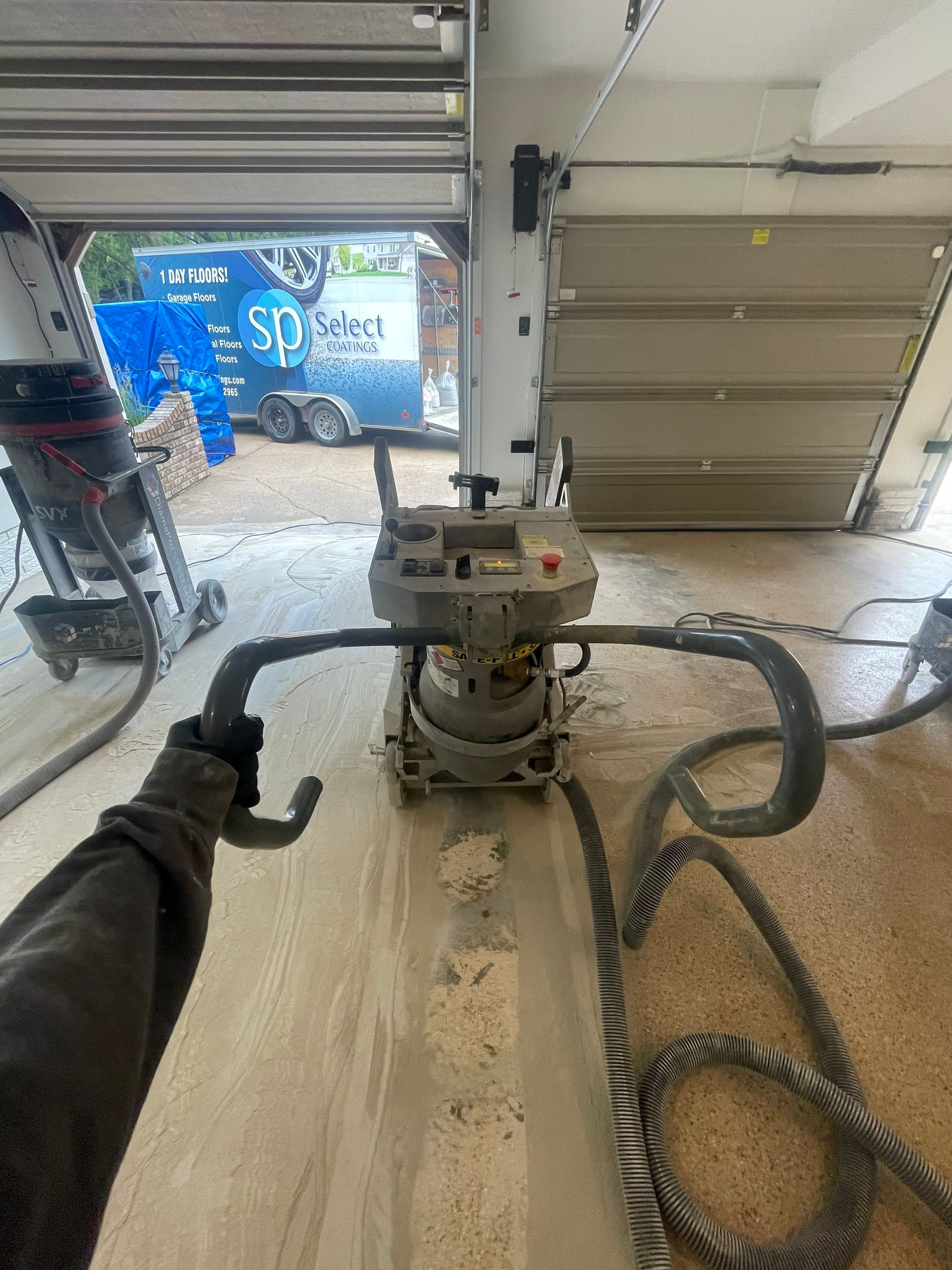 Gray Speckled Epoxy Garage Floor Coating in Sioux Falls by Select Painting, Coatings & Garage Cabinets