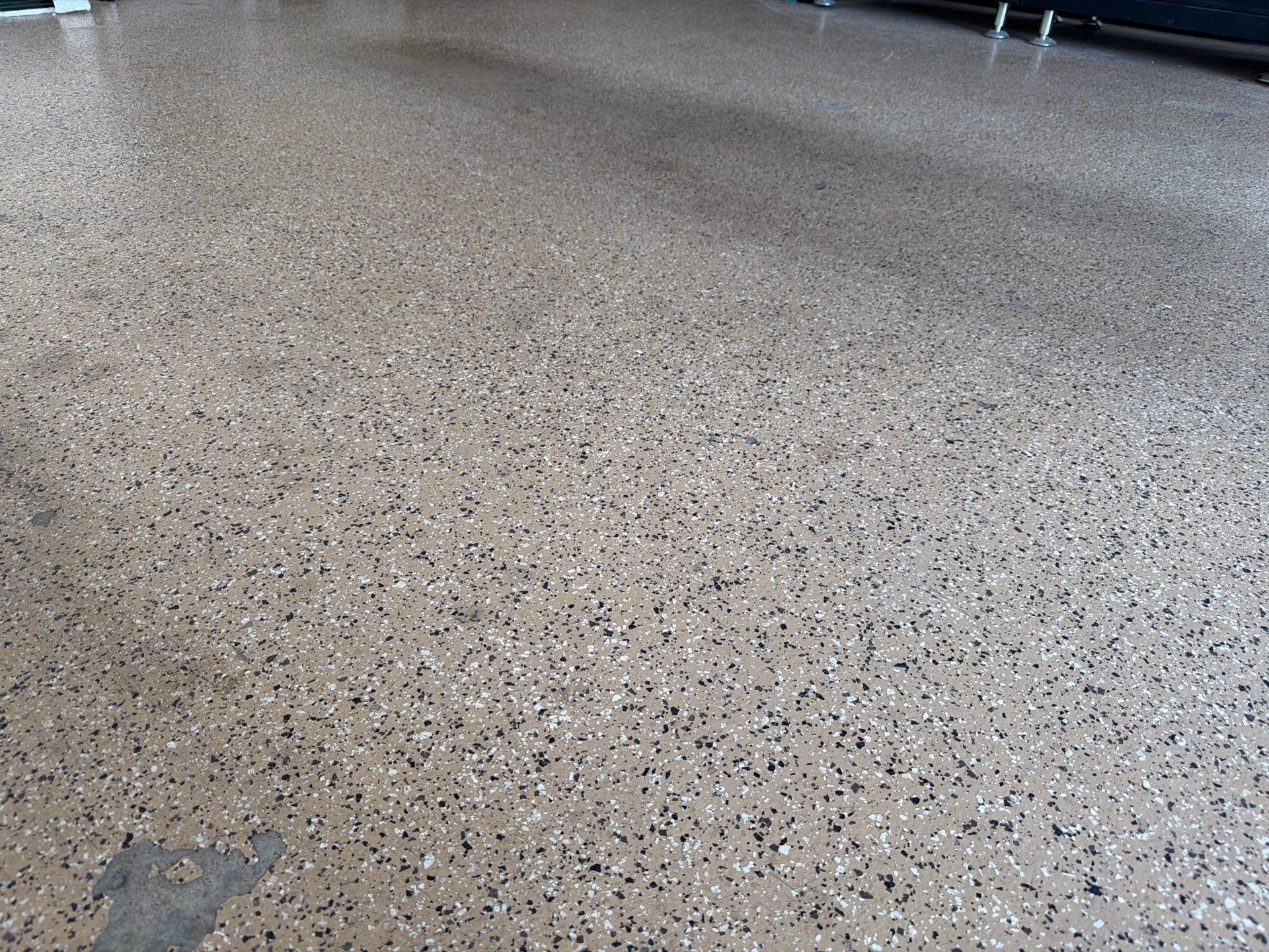 Gray Speckled Epoxy Garage Floor Coating in Sioux Falls by Select Painting, Coatings & Garage Cabinets