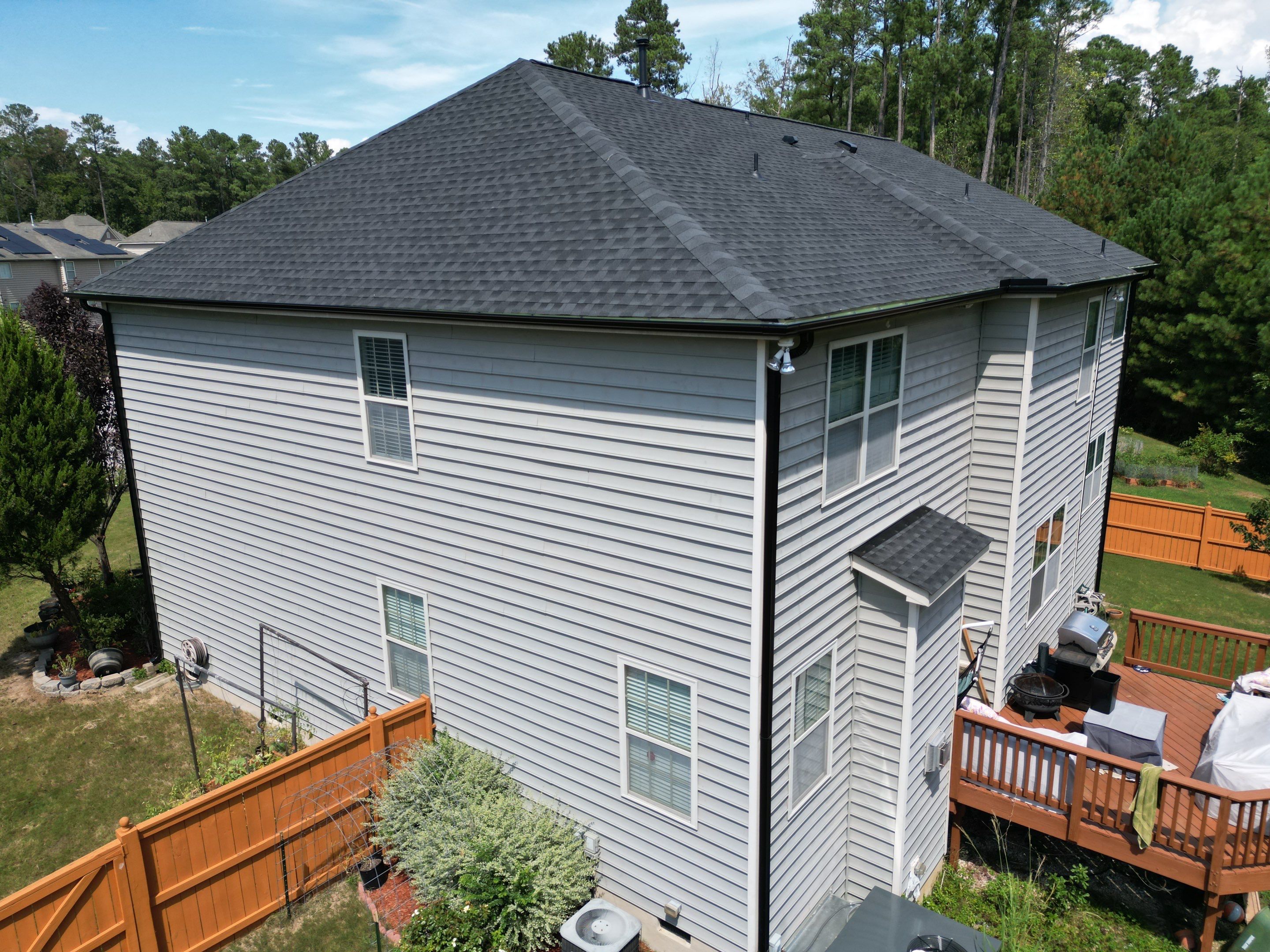 Roof Replacment - GAF Timberline HDZ Charcoal with 5” black seamless gutters  by Pro Performance Roofing