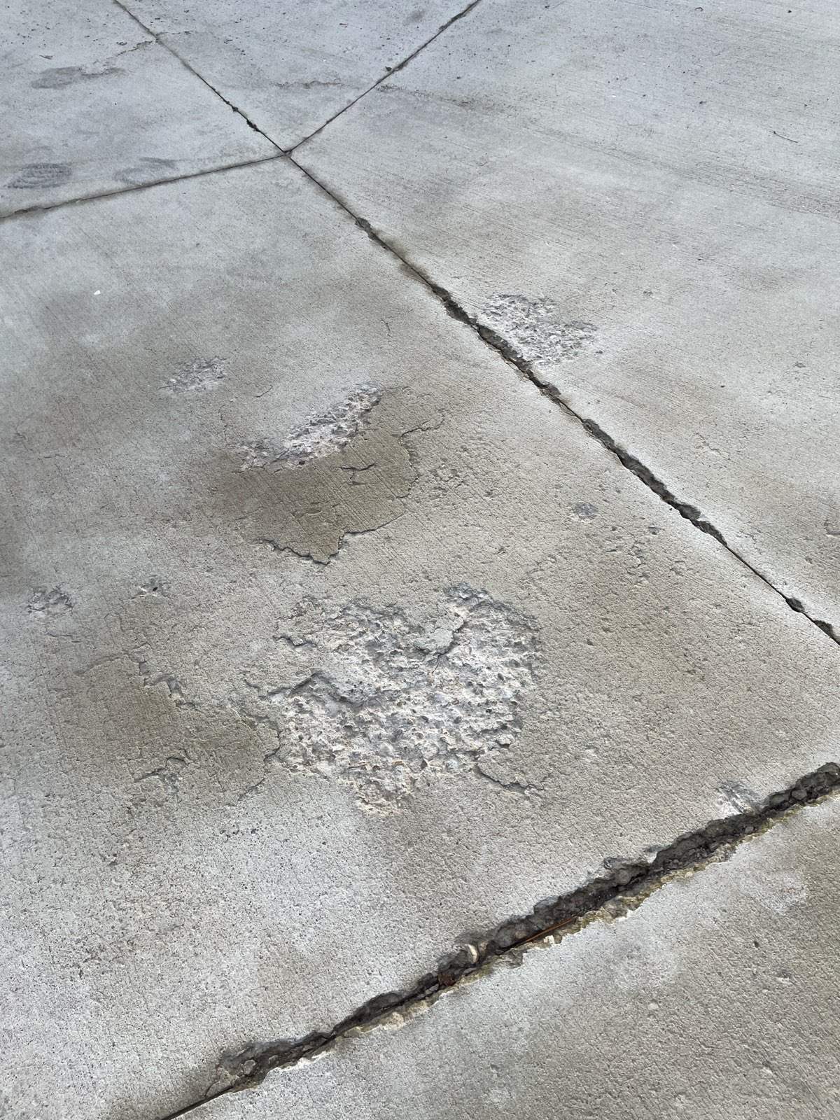 Deteriorated Driveway Makeover by Mr. Mudd Concrete