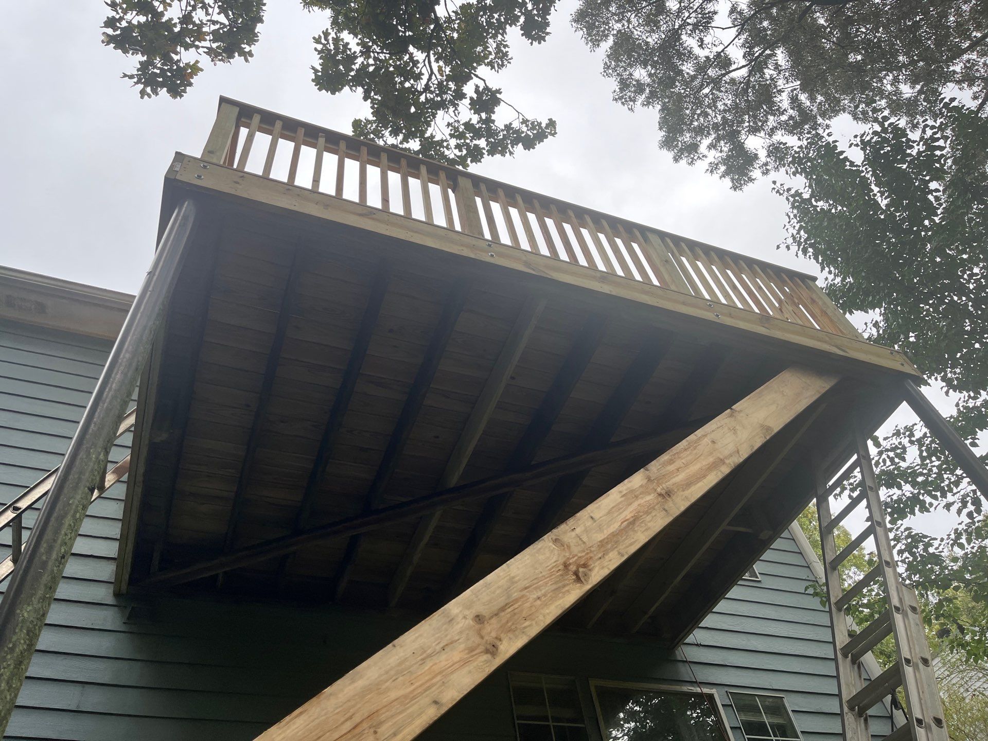 Deckorators Deck Resurface on Front Porch and Wood Deck Resurface on Back Deck by Nelson Exteriors 