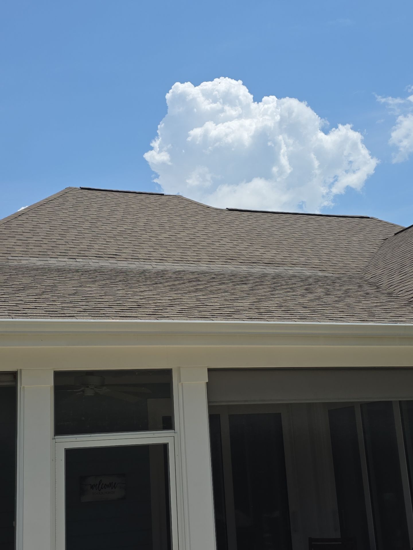 Targeted Roof Repair to Resolve Sliding Door Leak in Leland by RGR Construction and Roofing, LLC