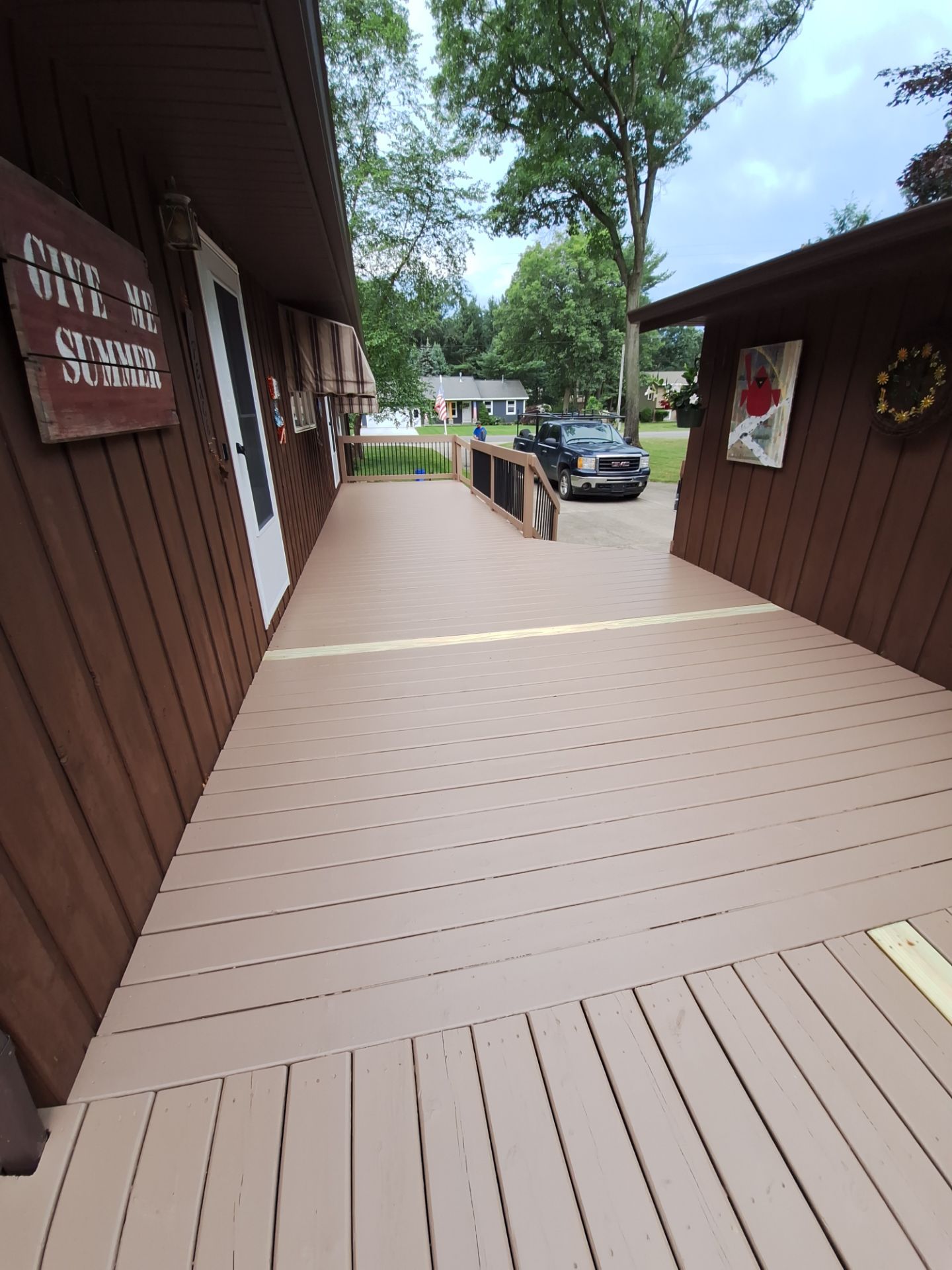Muskegon Deck Restoration with Pressure Treated Railings and Wood Staining by Gordon Painting