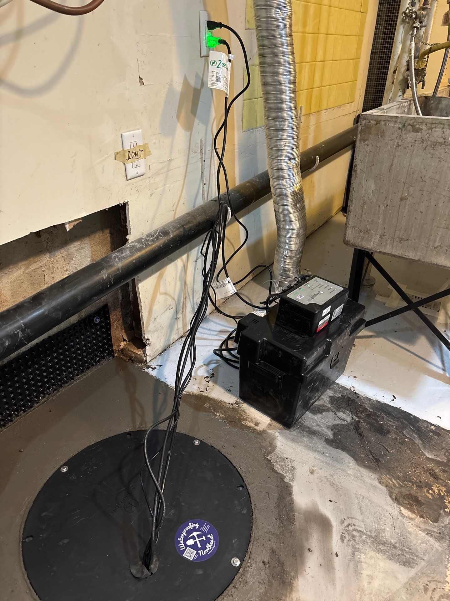 Interior Drain Tile & Sump Pump Installation in St. Paul, MN by Waterproofing Northeast