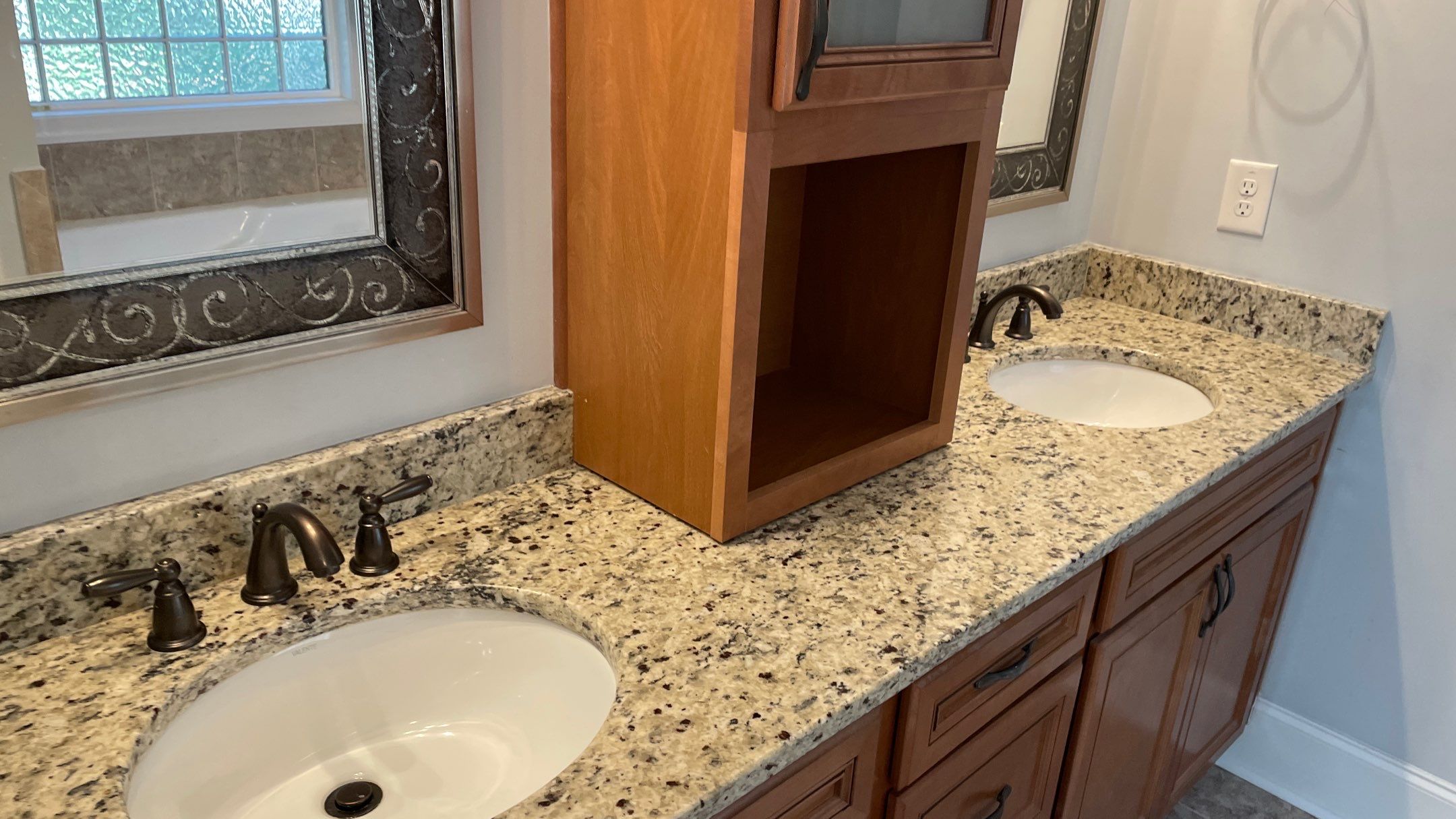Bright Bathroom Remodel with Wall Removal, Stand Alone Tub and New Vanity by Footprints Floors of Coastal Carolina