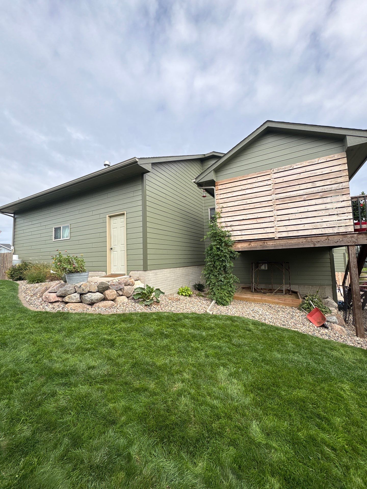 Residential Exterior Painting and Siding Update in Brandon by Select Painting, Coatings & Garage Cabinets