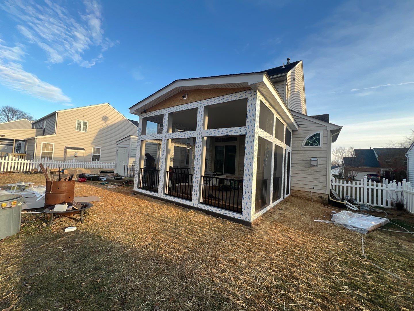 Custom Screened-In Porch with Stamped Concrete Patio in Warrenton by Jakari Restoration & Construction LLC