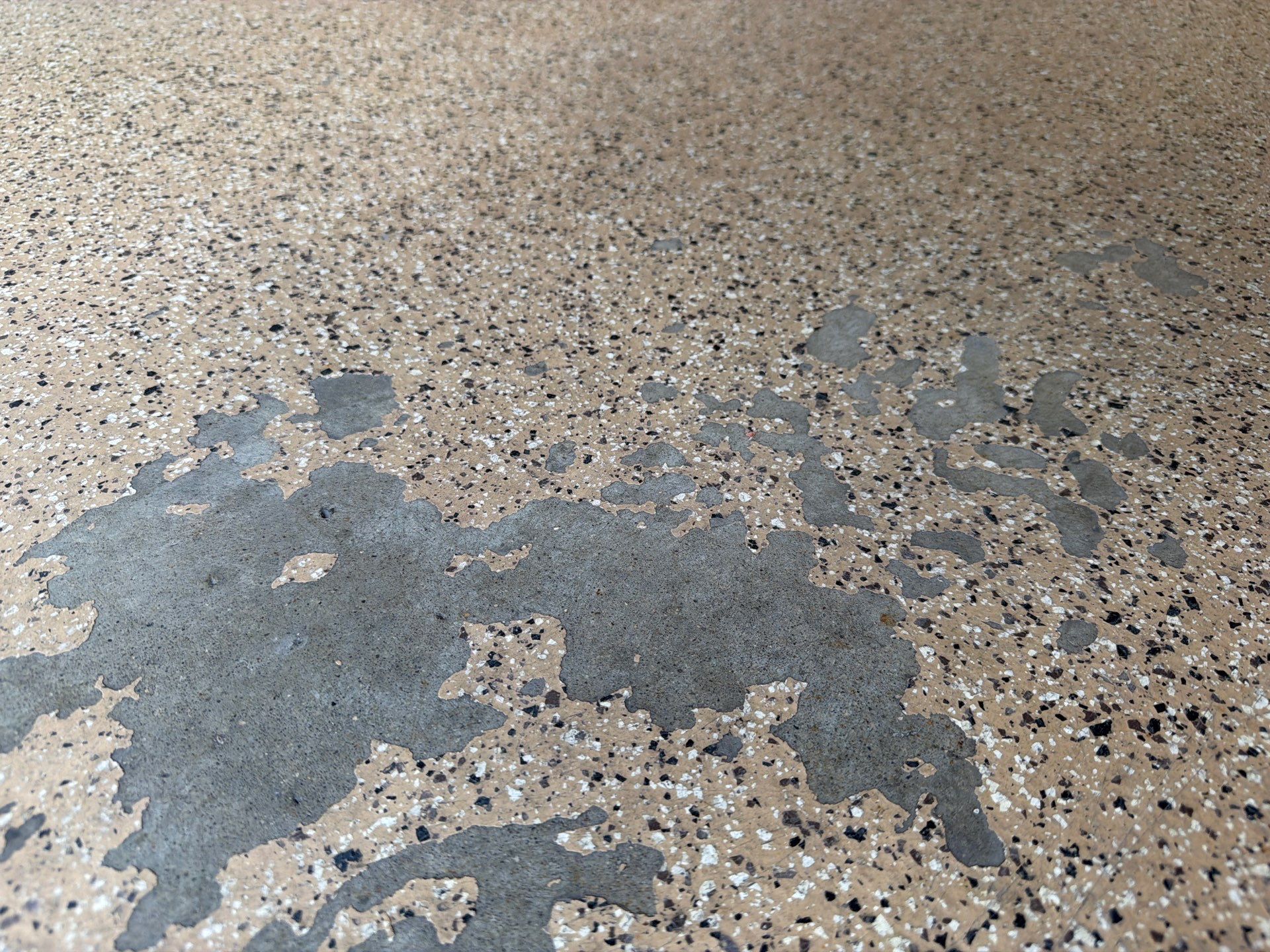 Gray Speckled Epoxy Garage Floor Coating in Sioux Falls by Select Painting, Coatings & Garage Cabinets
