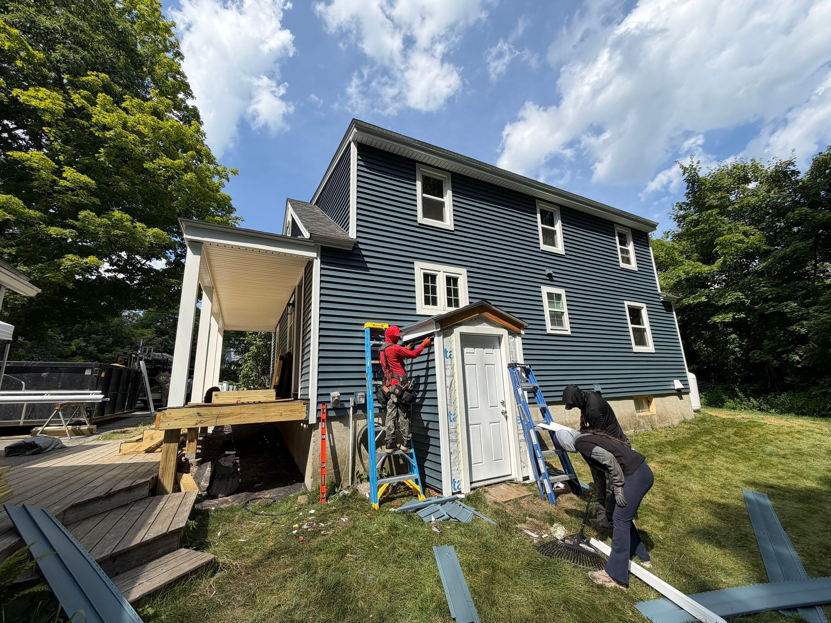 Complete Exterior Renovation Featuring Owens Corning Shingles and Vinyl Siding by Tall pine roofing