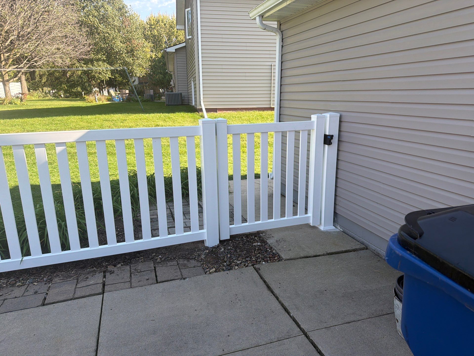 White Vinyl Picket Pool Fence Installation in Waterloo, Iowa by Perfect Picket Fence and Stain