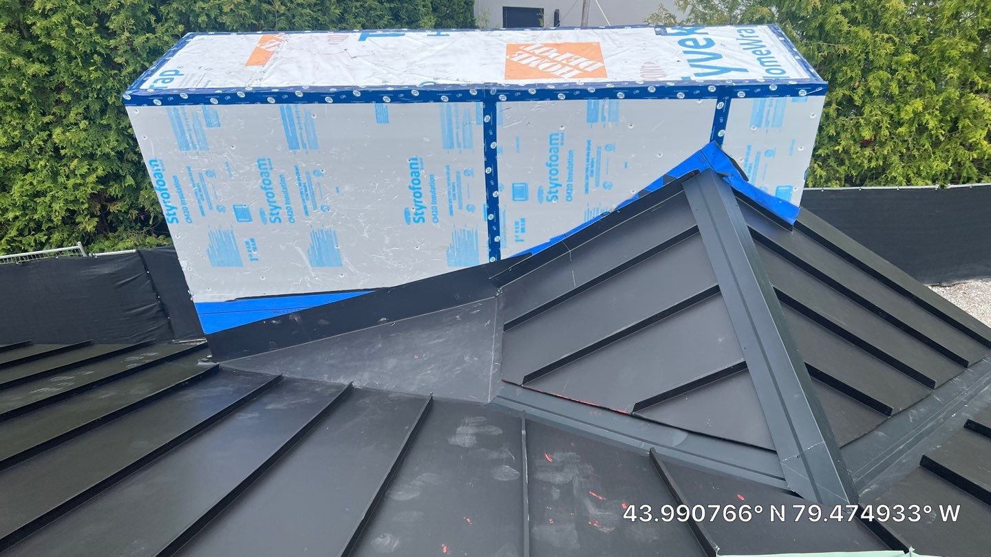 Custom Home Jet Black 24 GA Standing Seam Roof  by Jay Carter Roofing & Sheet Metal