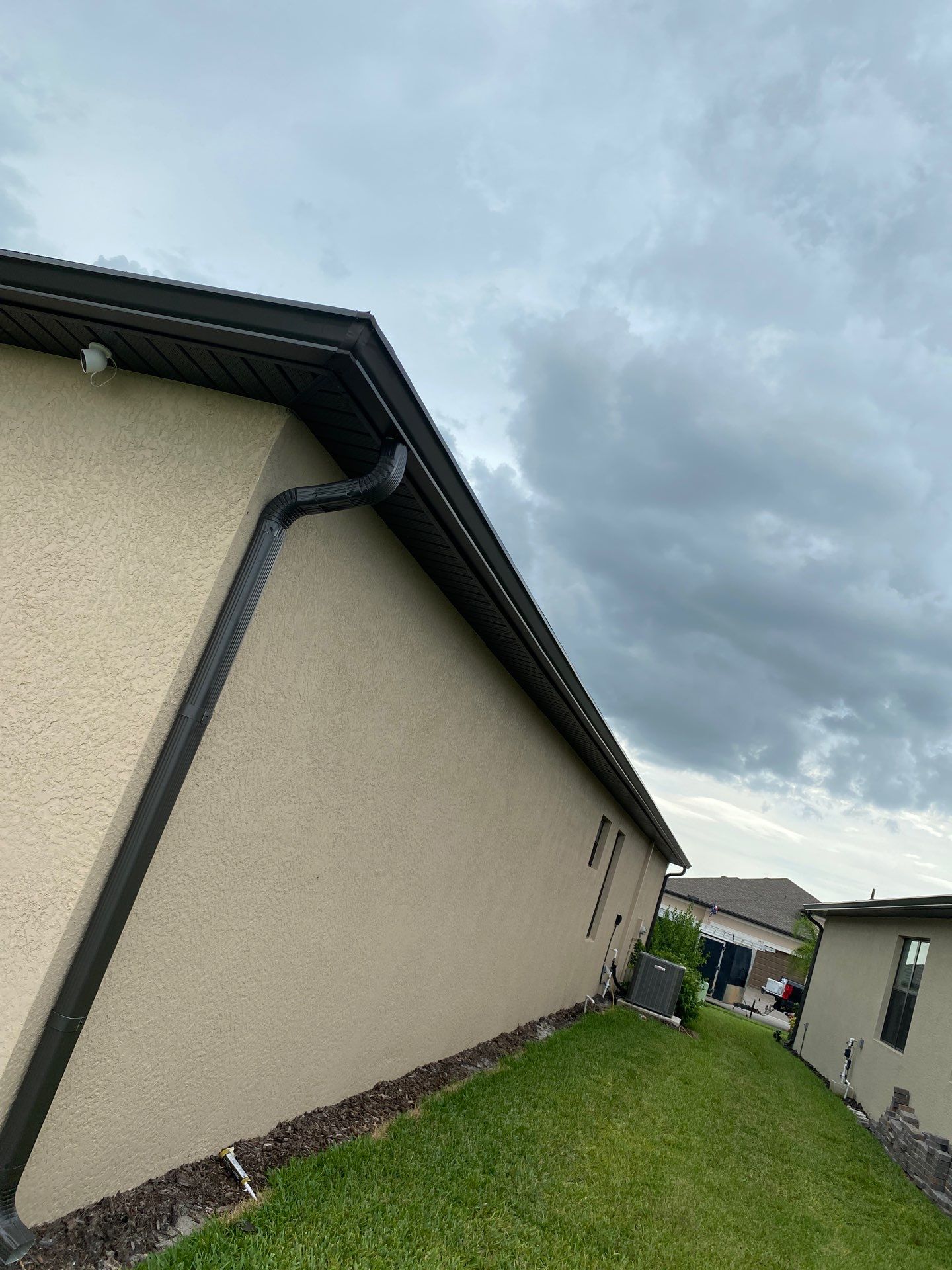 Brown Seamless Gutters for Homes in Fort Myers by Gutter Professors