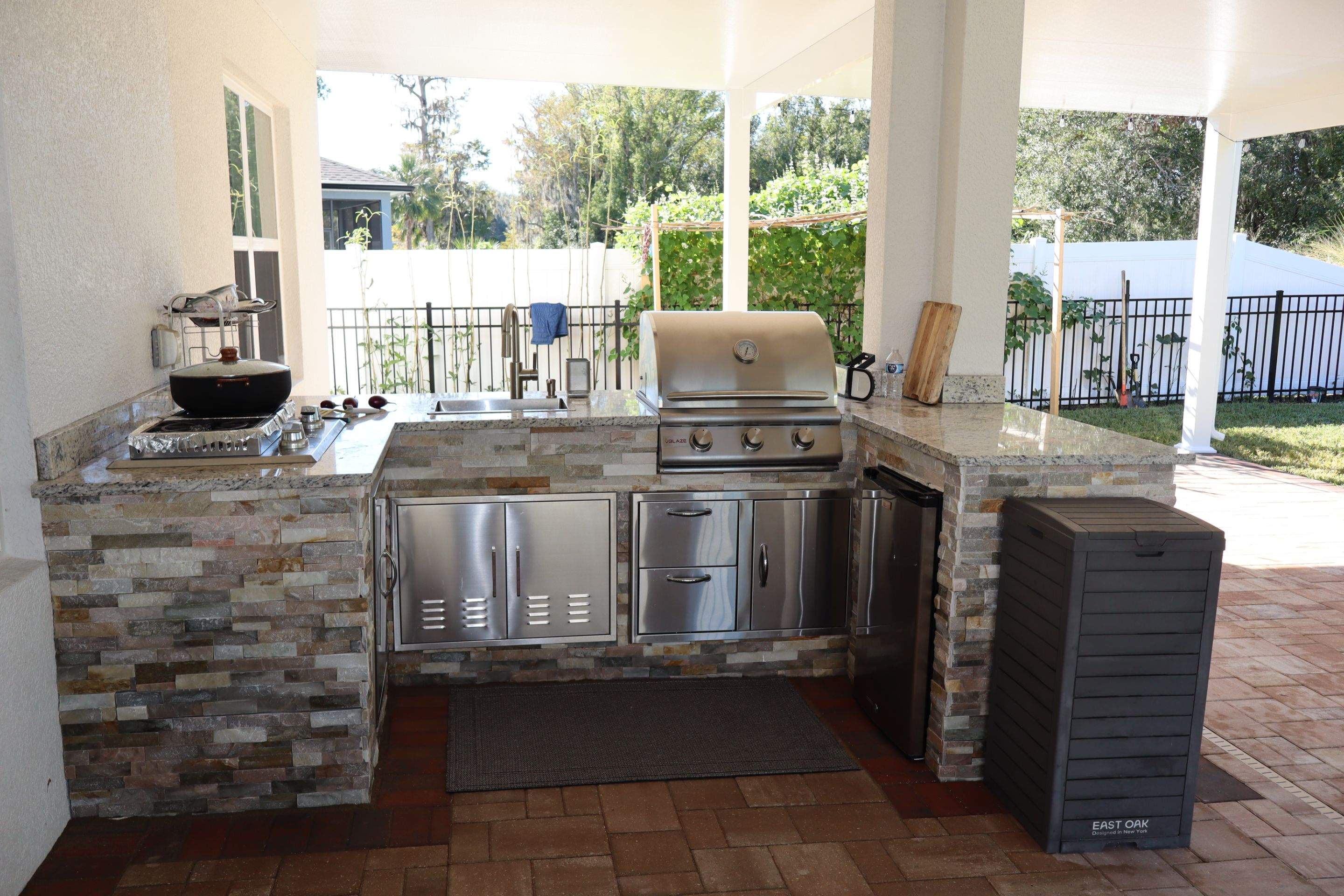 Patio cover with kitchen by Orlando pergolas 