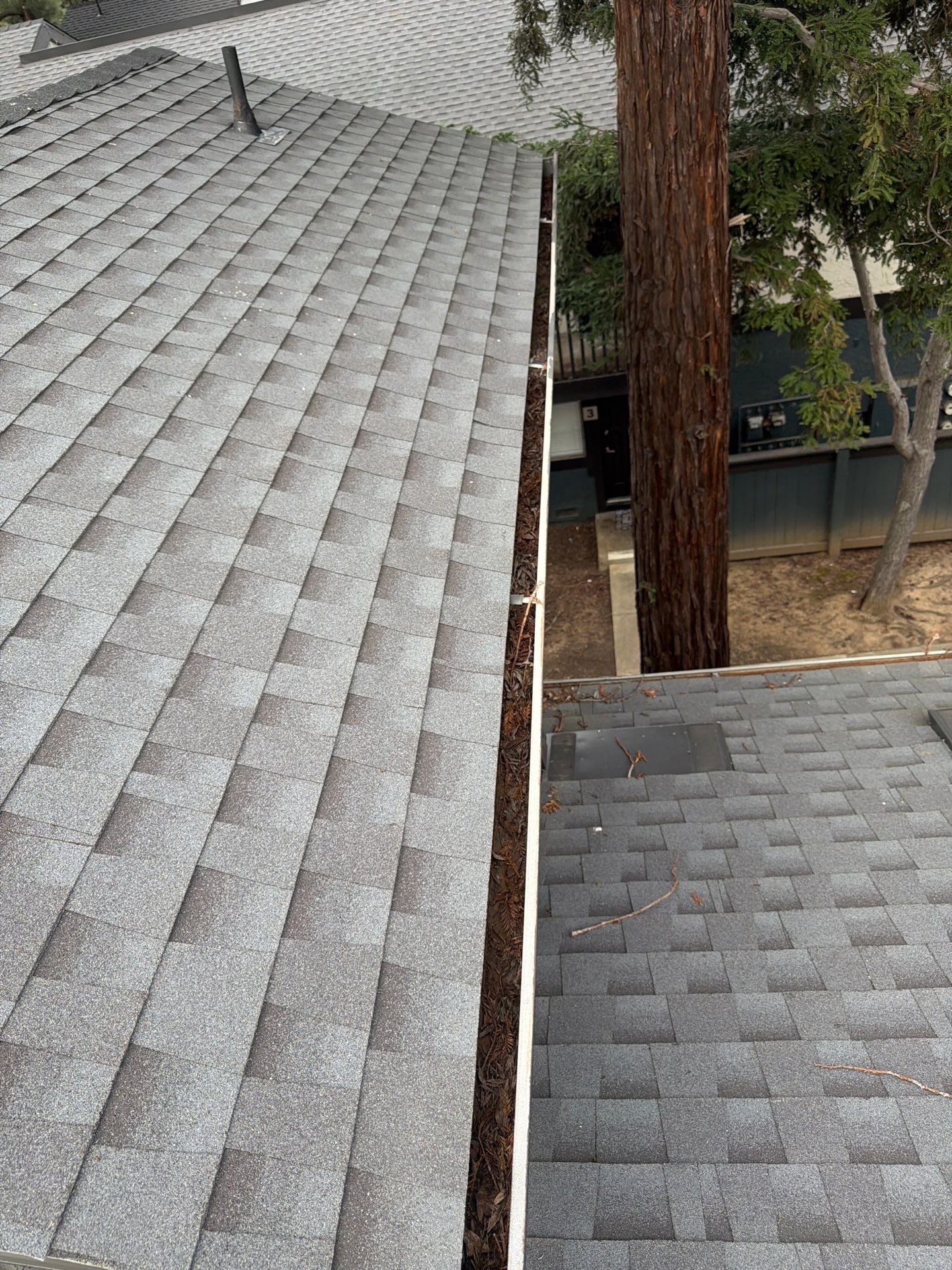 HOA gutter cleaning in Napa, CA,before  photo showing full gutters.