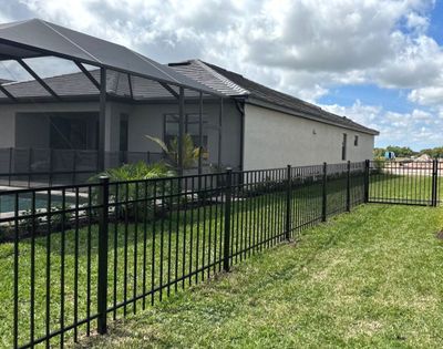 Aluminum Fence Installation using Black 3 Rail Aluminum Fence
