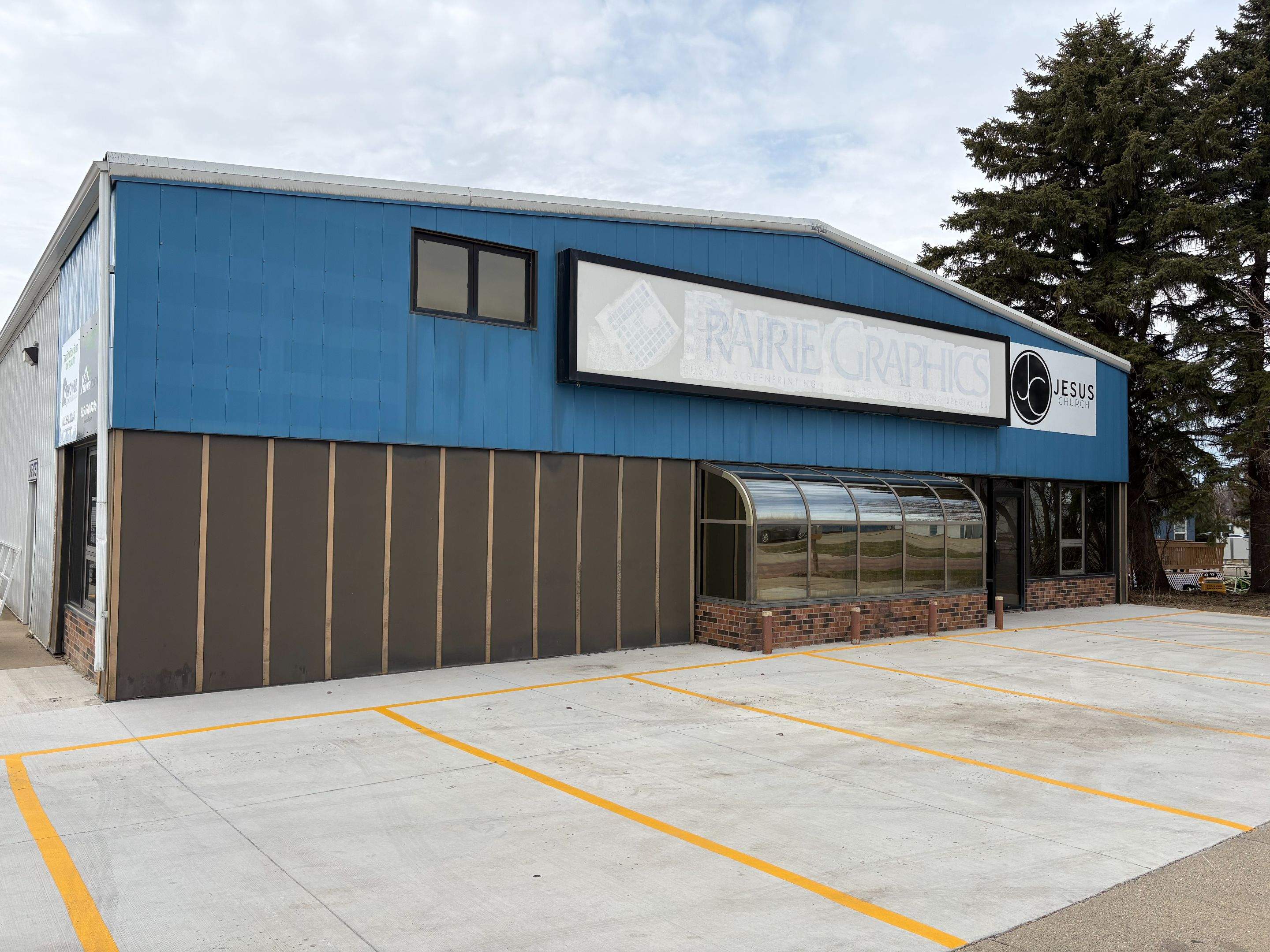 Commercial Shop Renovation and Concrete Parking Installation in Brookings by Select Painting, Coatings & Garage Cabinets