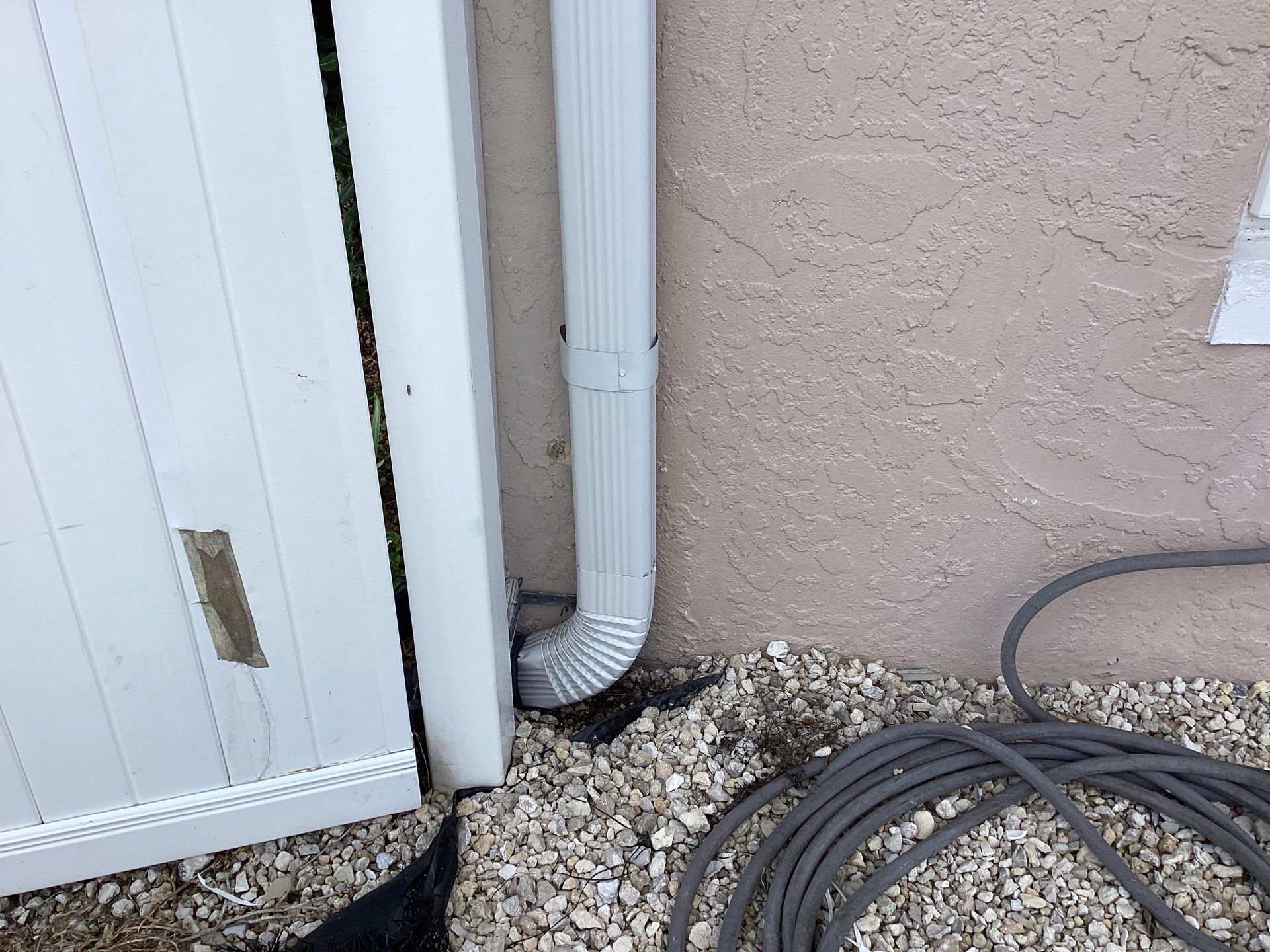 White Seamless Gutters and Splash Guards in Fort Myers FL by Gutter Professor by Gutter Professors