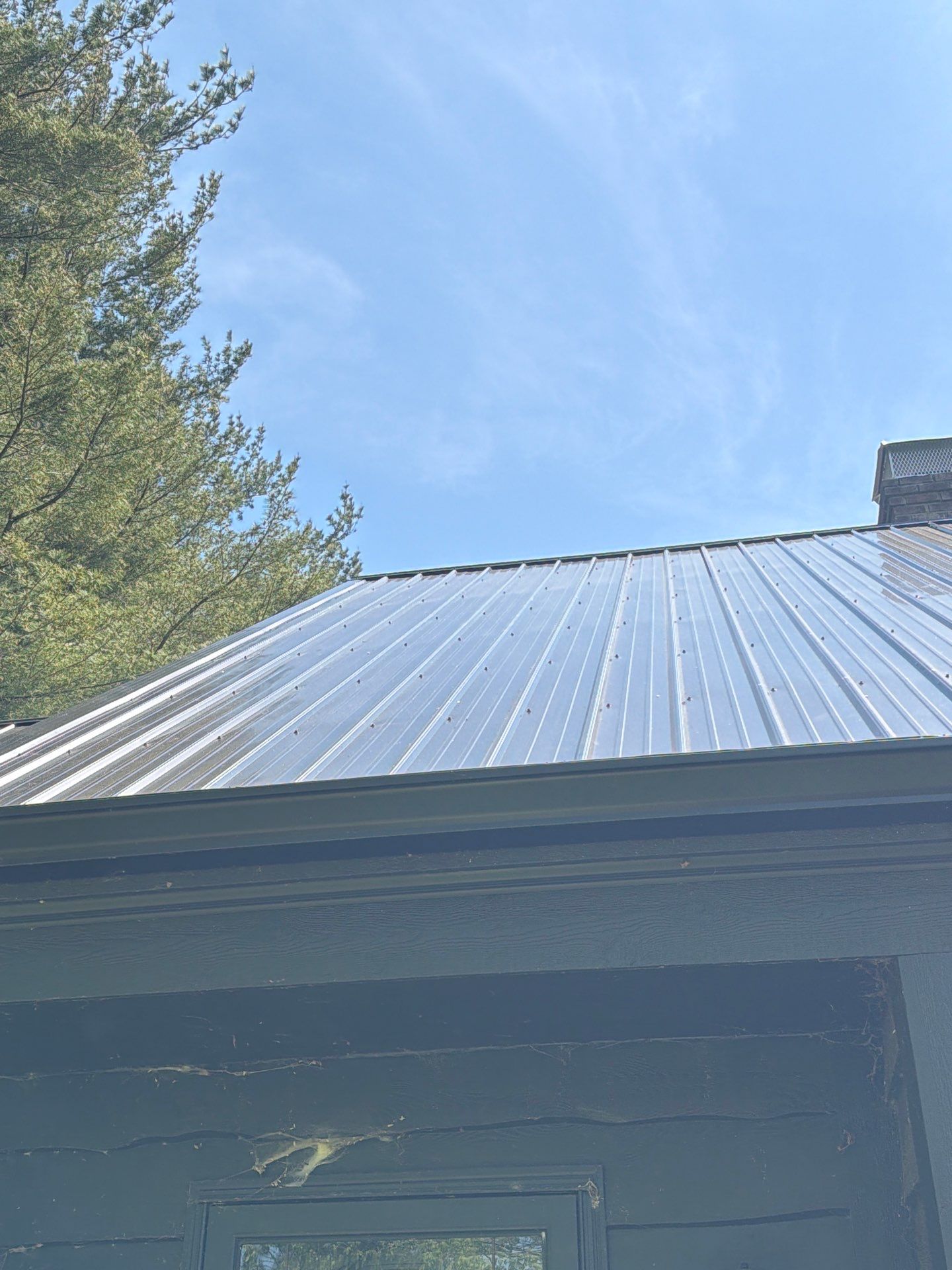 Classic Rib Metal Roofing - Shiny Black by Hoel Roofing & Remodeling