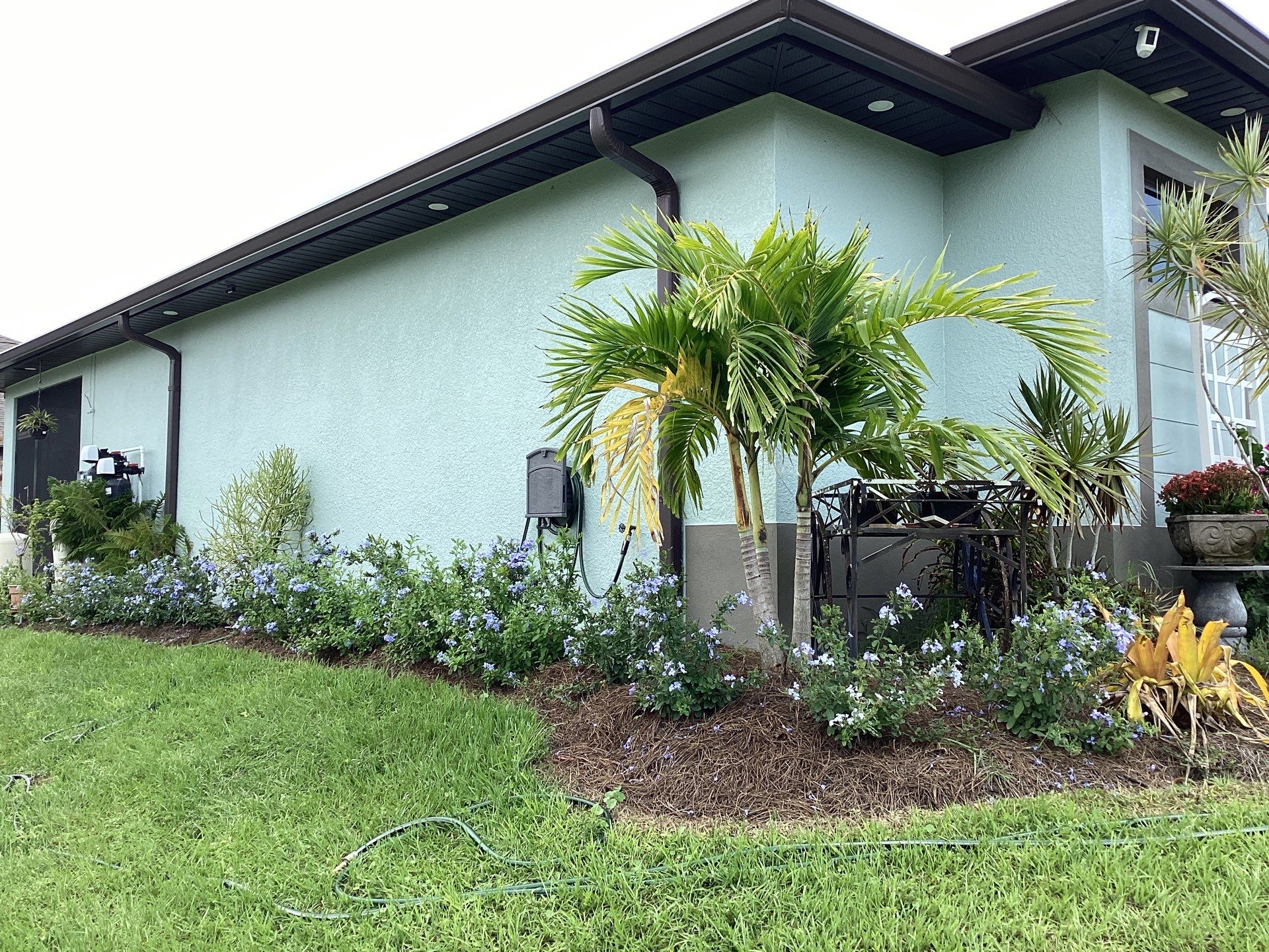 Musket Brown and New Downspouts in Lehigh Acres, FL  by Gutter Professors