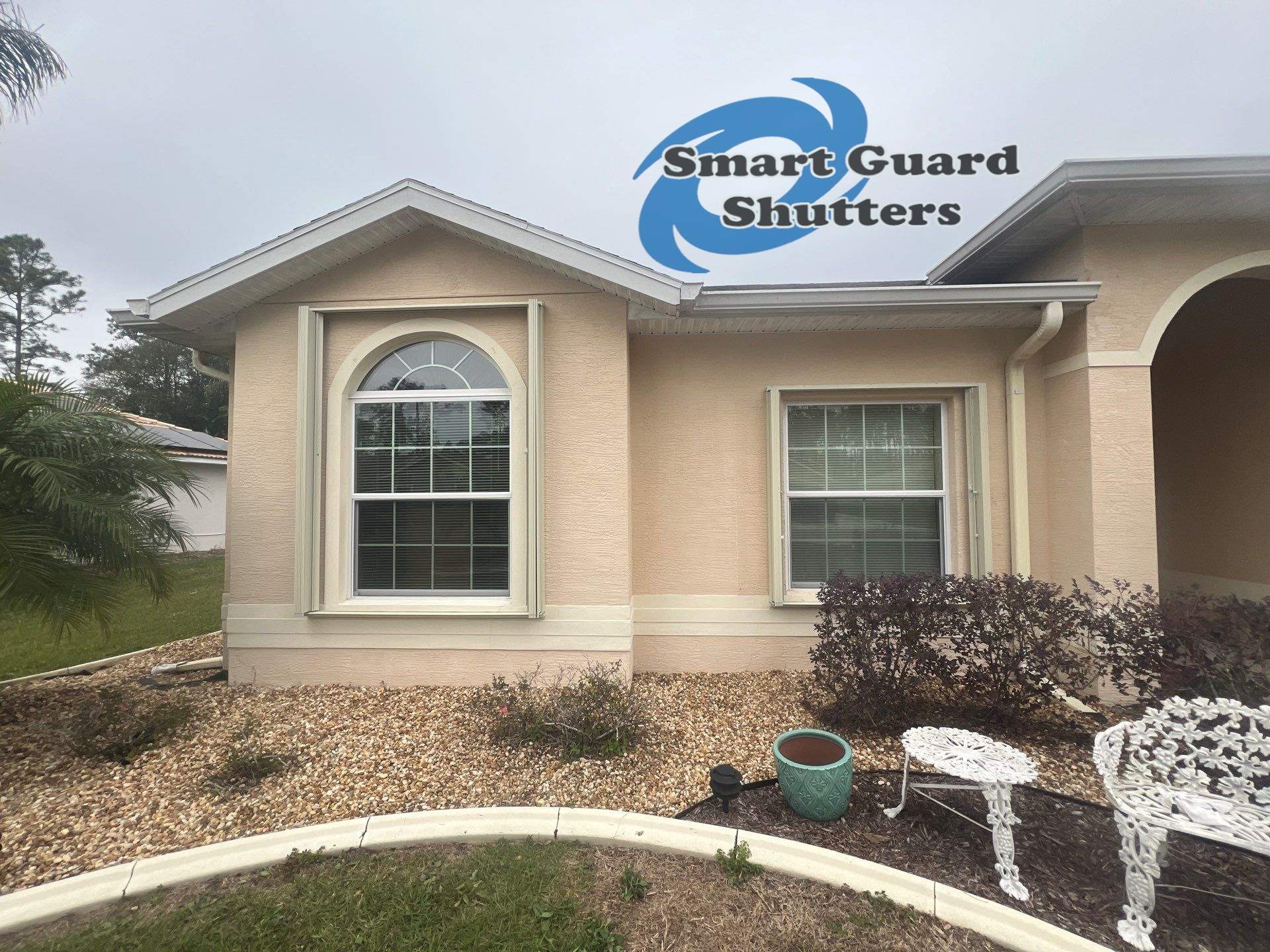 Accordion Shutters in Ivory by Smart Guard Shutters