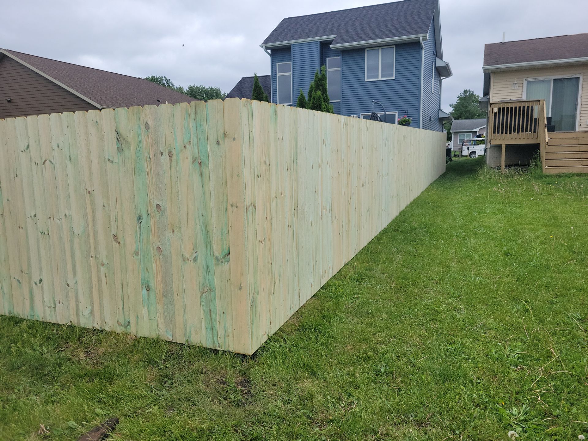 Pressure-Treated Wood Privacy Fence Installation in Waterloo by Perfect Picket Fence and Stain
