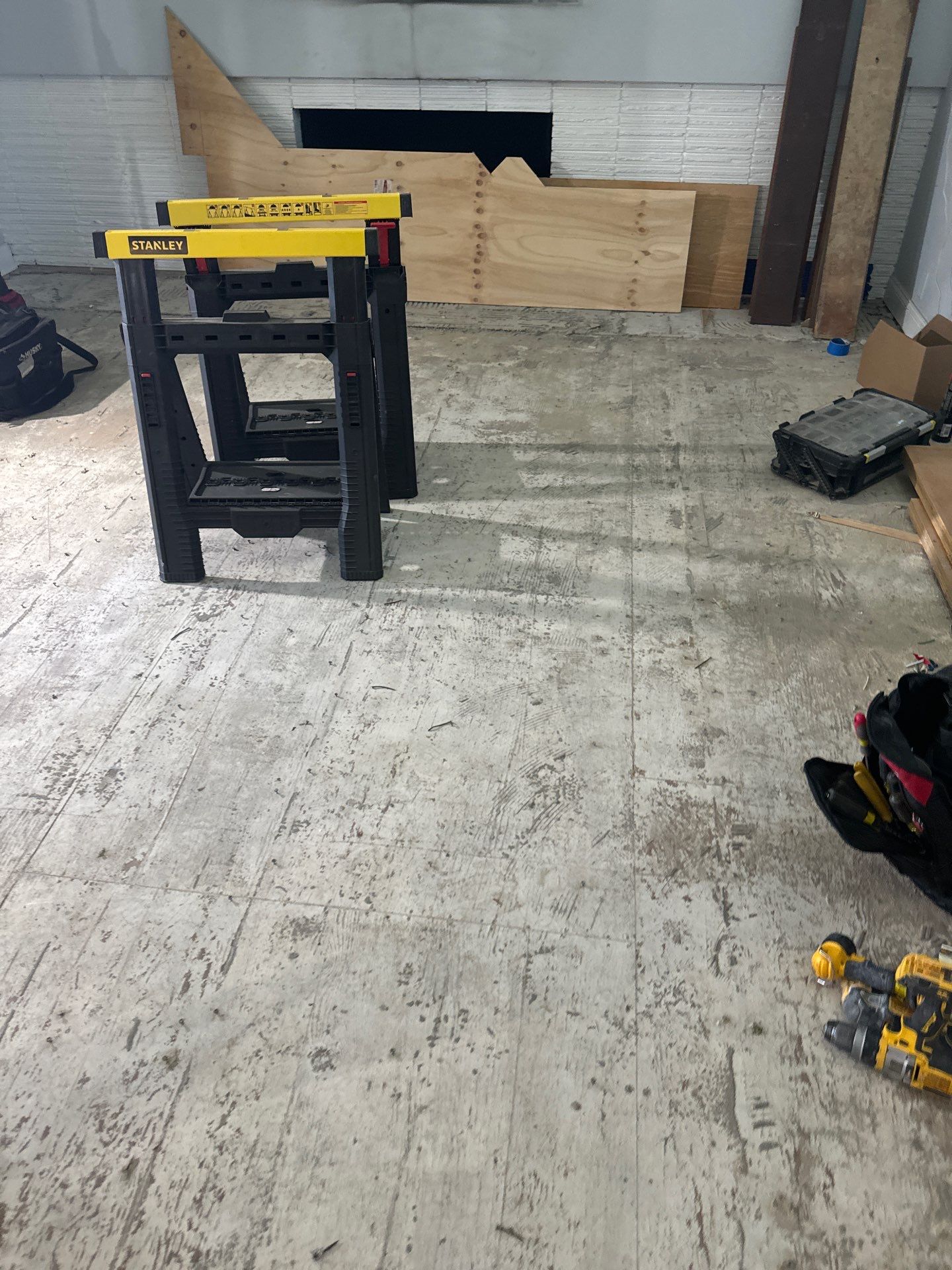 New Flooring installation using 4" White oak select grade plain sawn Ebony Stain by Ann Arbor Hardwoods