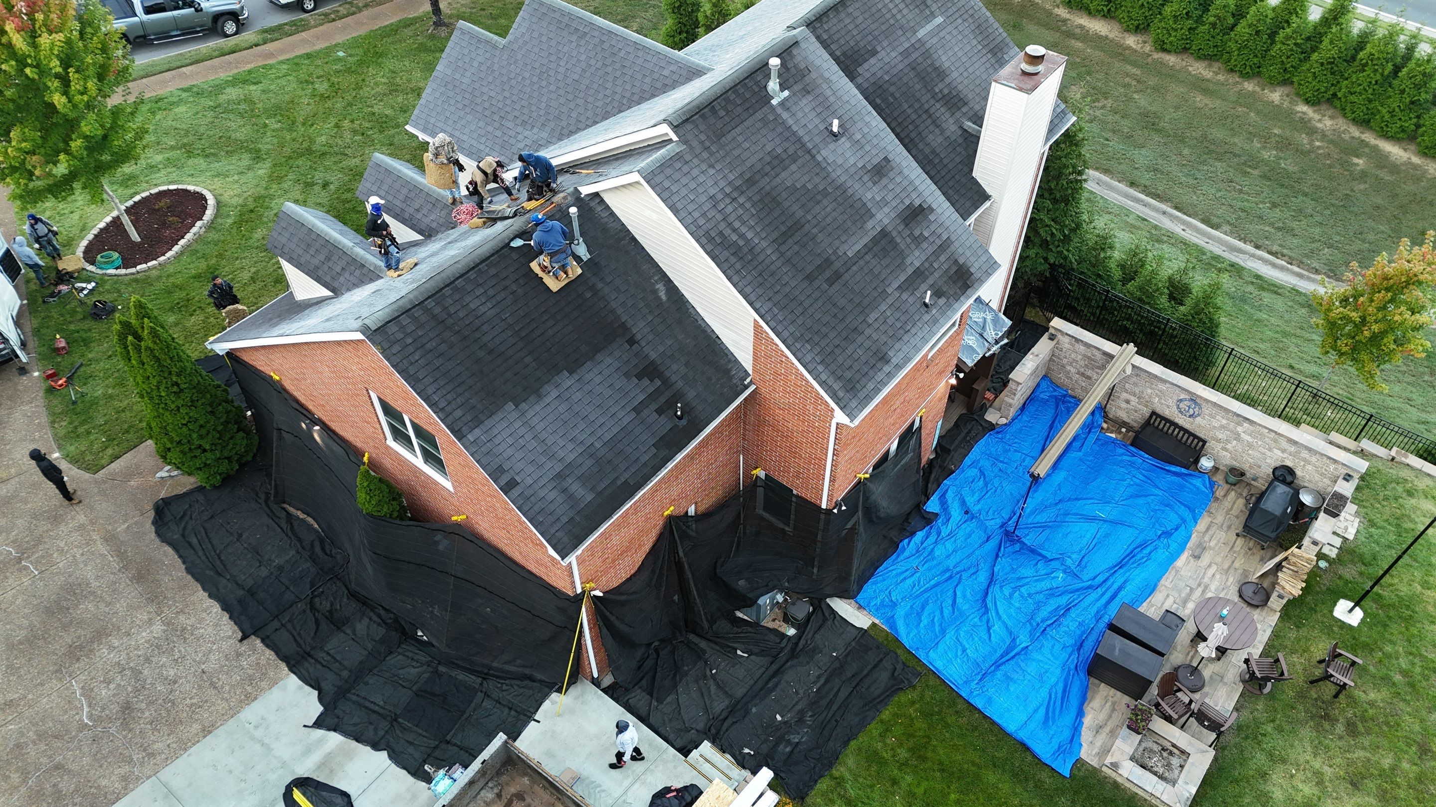 Charcoal Black Re-Roof & Gutters by Royal House LLC