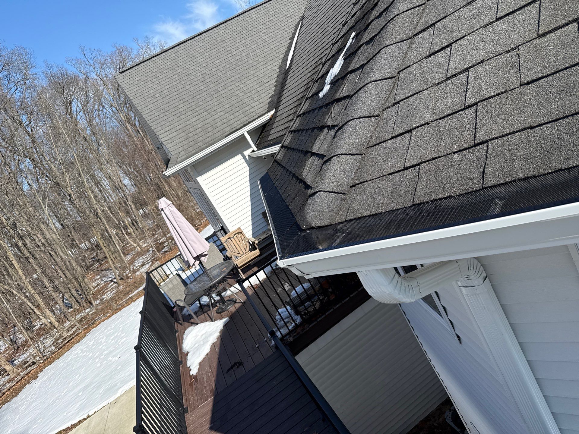 Commercial gutter with screen in Dewitt by Sunrise Seamless
