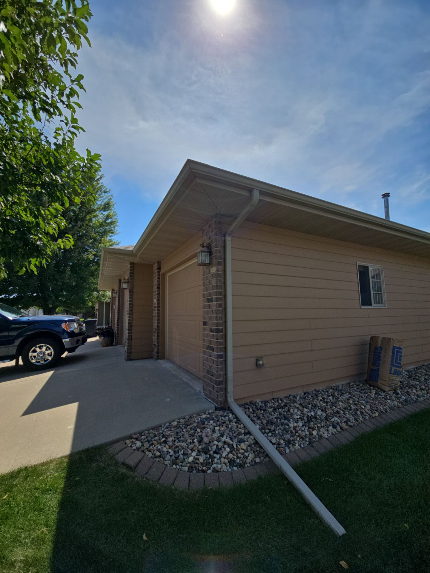 Sioux Falls Residential Exterior Door and Siding Refresh by Select Painting, Coatings & Garage Cabinets