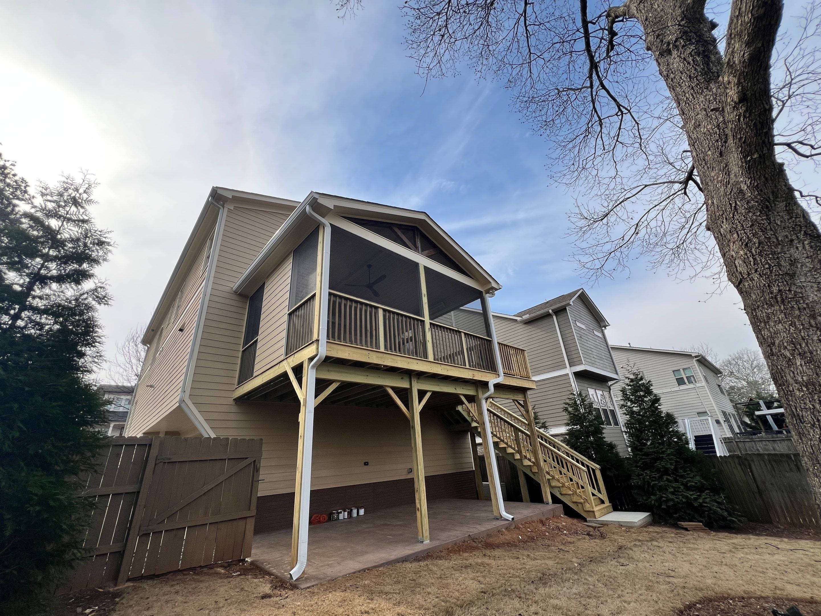 Screened-In Porch With Fireplace by Swift Home Renovations 