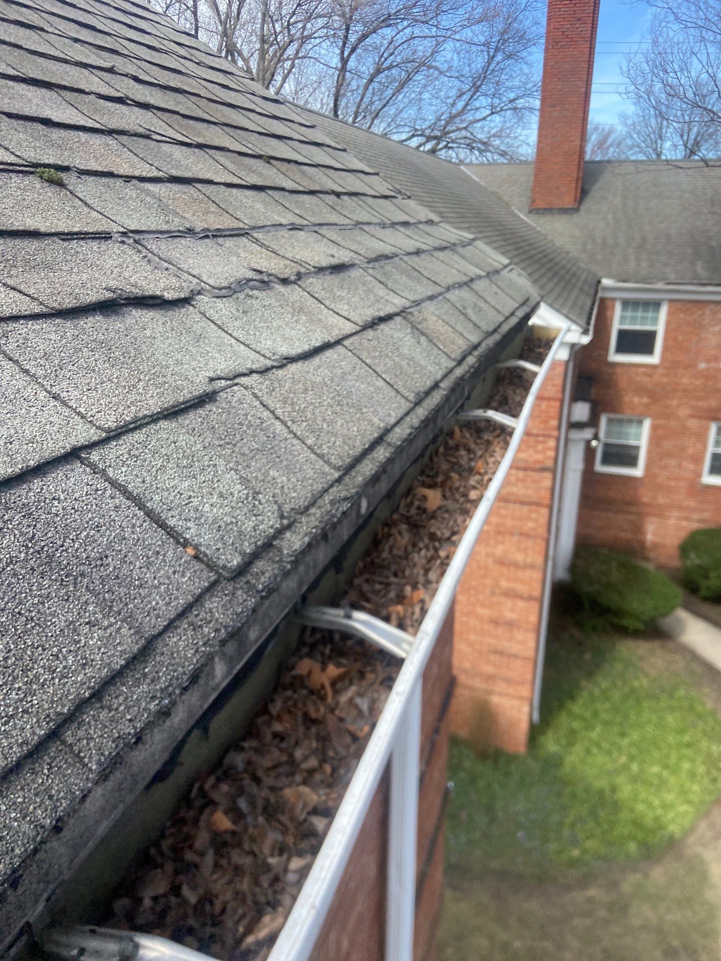 Commercial gutter cleaning Cleveland before photo with filled gutters