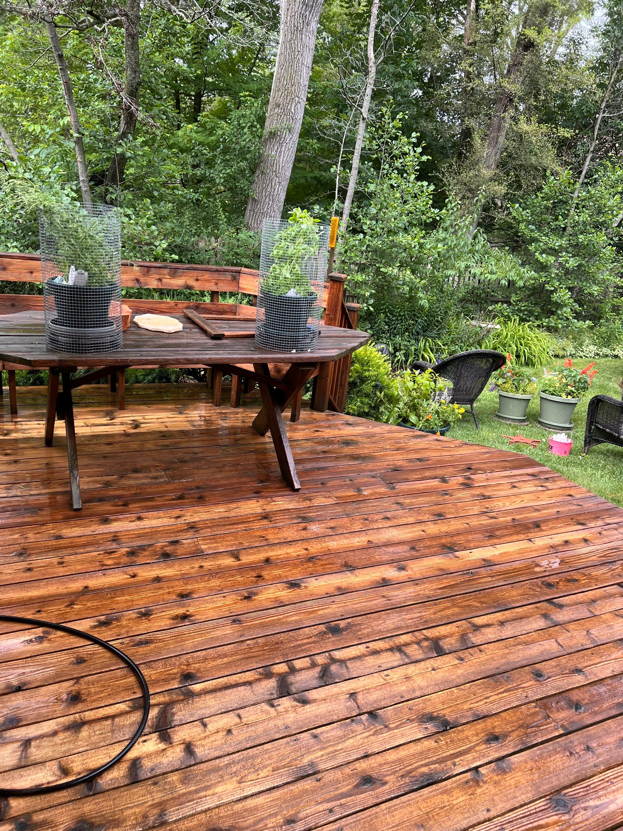 Wood deck cleaning, board replacement and staining by Northern Power Washing LLC.