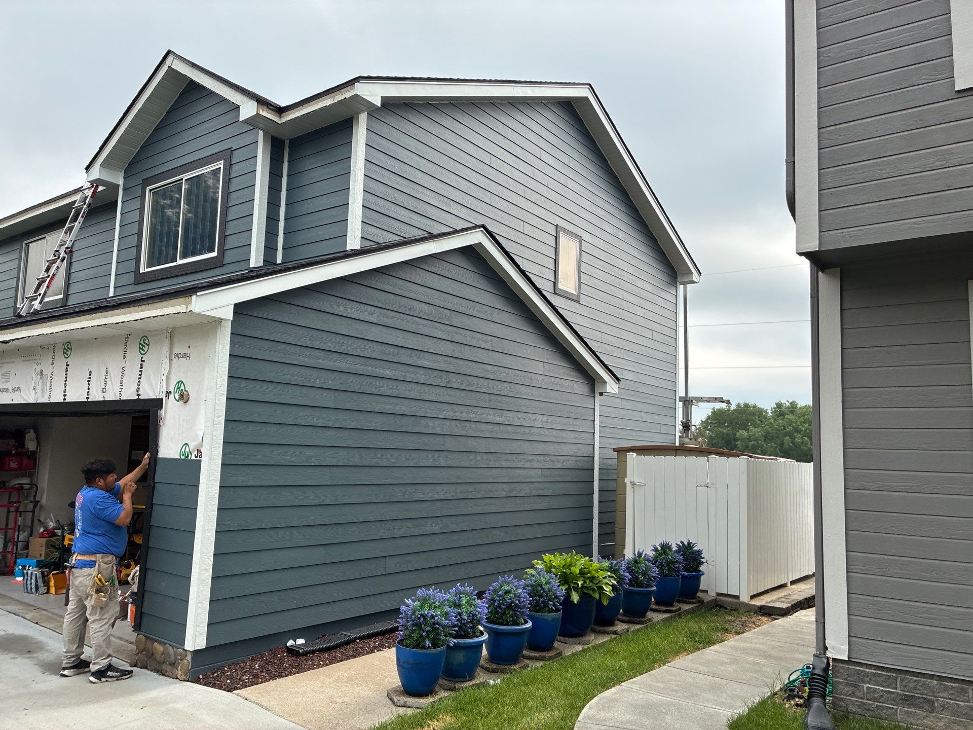 James Hardie Siding and Window Replacement with Arctic White Trim by Carps Complete Exteriors